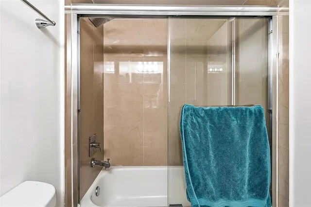 a bathroom with a shower and a tub
