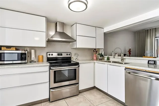 a kitchen with a stove and a sink