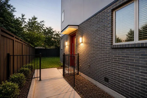 a view of a pathway both side of house
