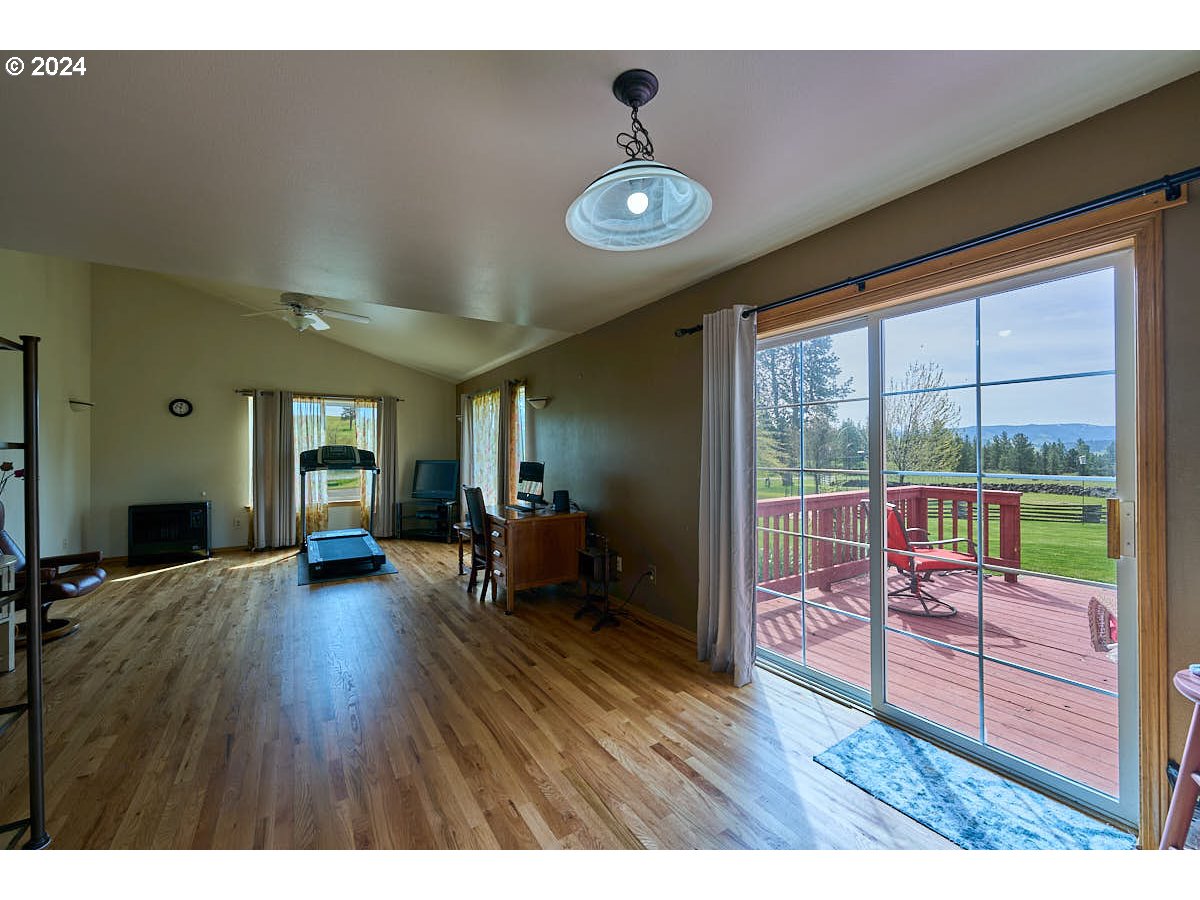 76012 Highway 82 Elgin, OR 97827 - Photo 11 of 41 a view of a livingroom with furniture wooden floor and a floor to ceiling window