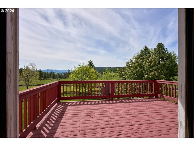 a view of balcony with wooden floor