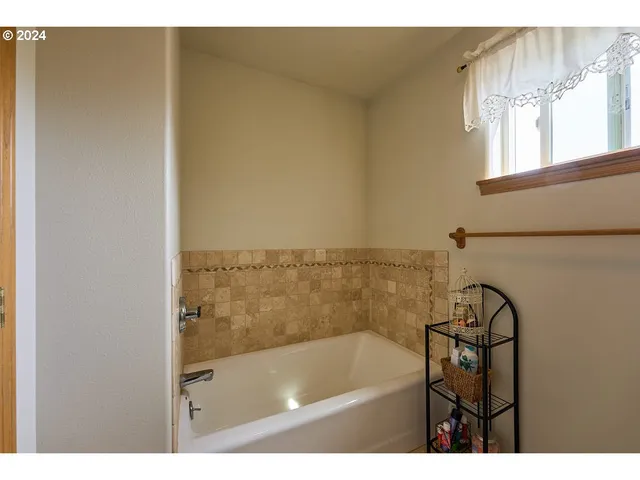a bathroom with a bathtub and a sink