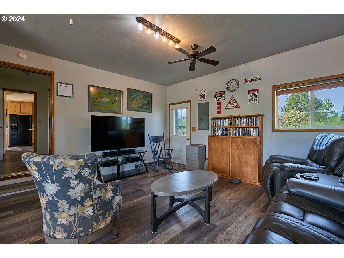 76012 Highway 82 Elgin, OR 97827 - Photo 6 of 41 a living room with furniture and a flat screen tv