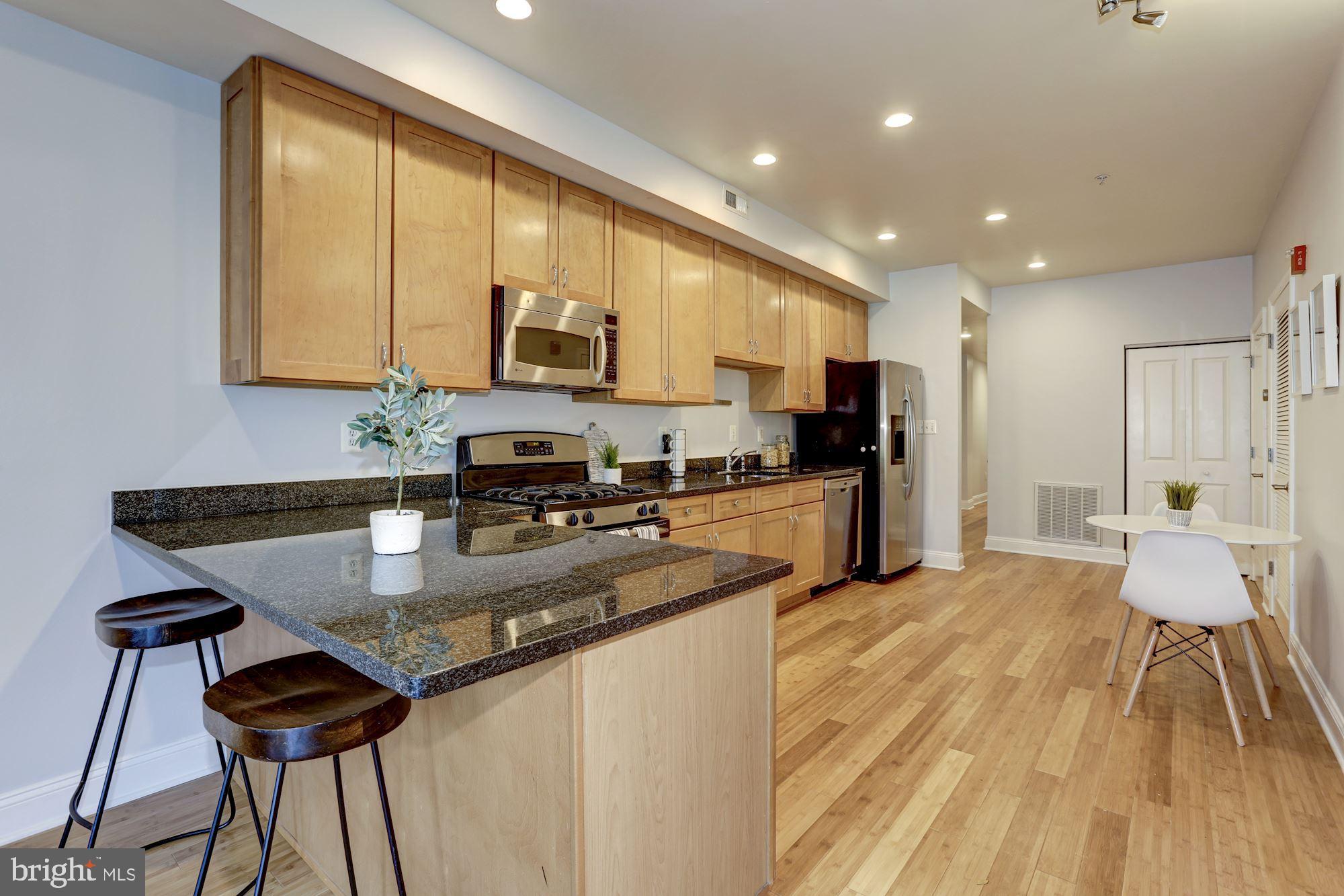 2713 Ontario Road Northwest, Unit 3 Washington, DC 20009 - Photo 3 of 21 Breakfast bar and open kitchen