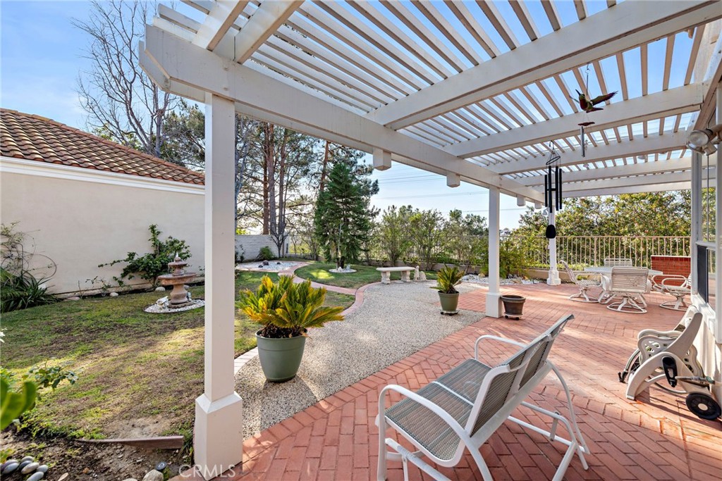 21191 Cancun Mission Viejo, CA 92692 - Photo 20 of 28 a building outdoor space with patio furniture and potted plants