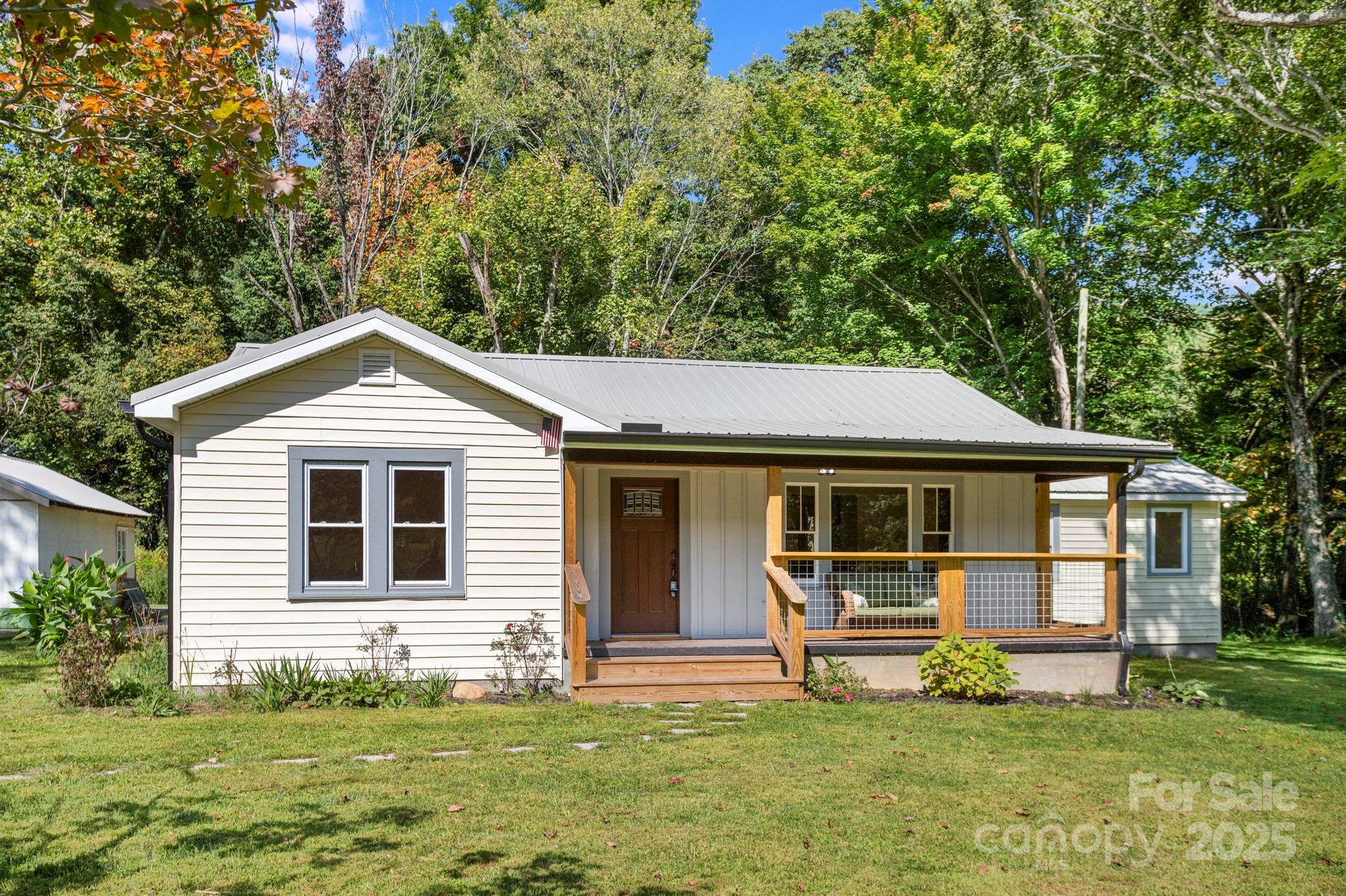 1808 Allens Creek Road Waynesville, NC 28786 - Photo 1 of 45 a front view of a house with a yard