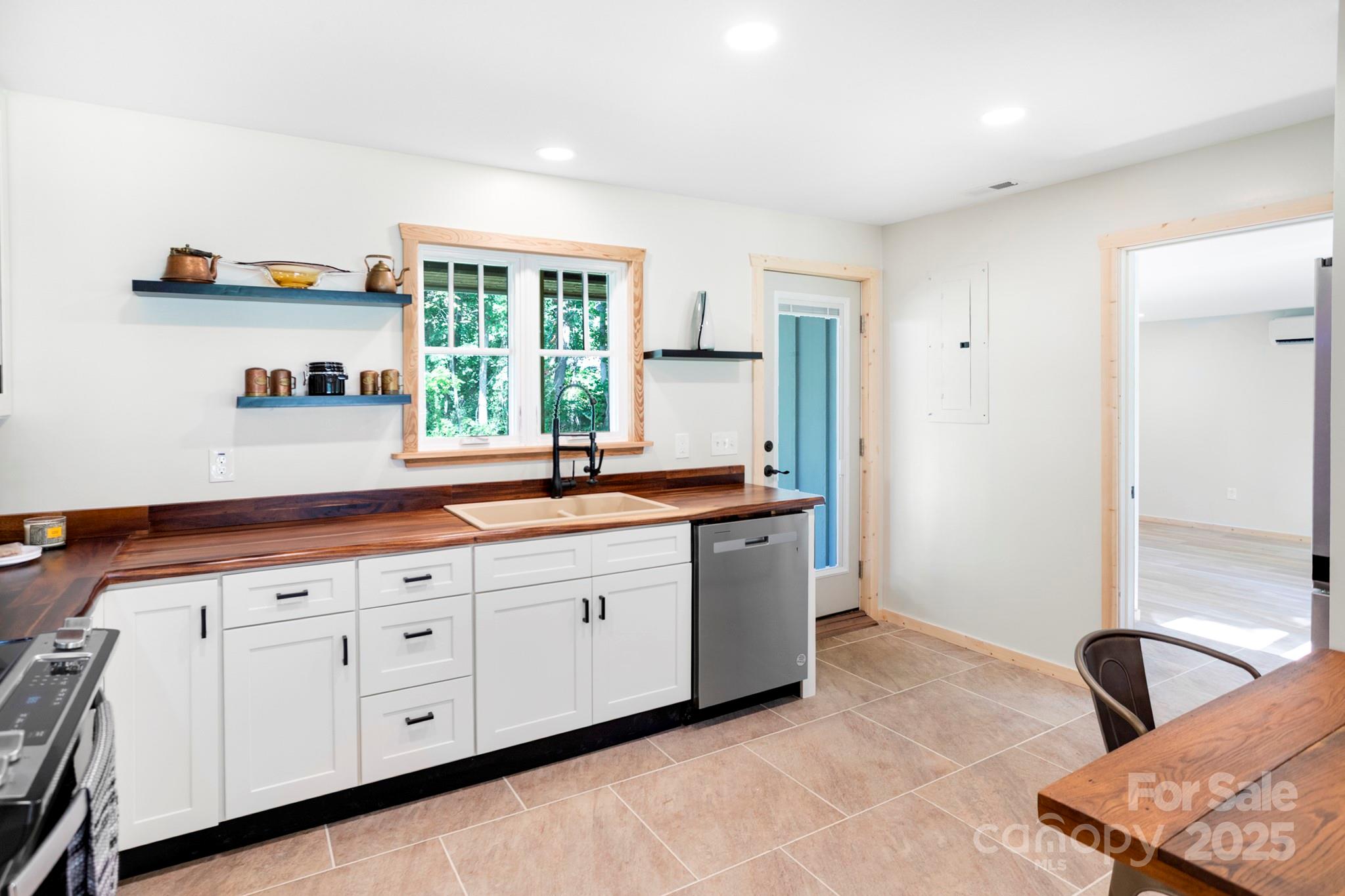 1808 Allens Creek Road Waynesville, NC 28786 - Photo 14 of 45 a living room with granite countertop furniture and a window