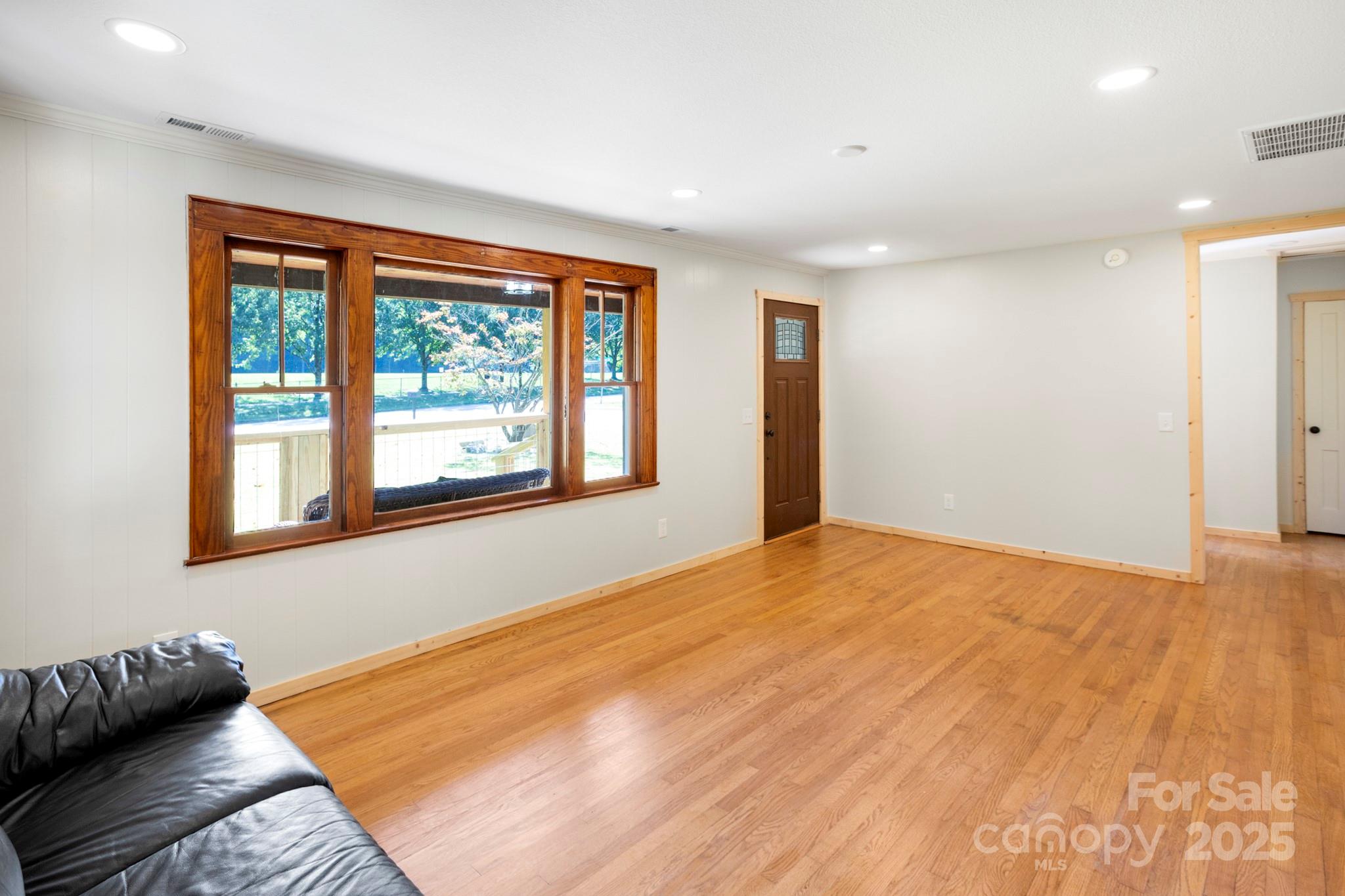 1808 Allens Creek Road Waynesville, NC 28786 - Photo 16 of 45 a bedroom with a bed and a window