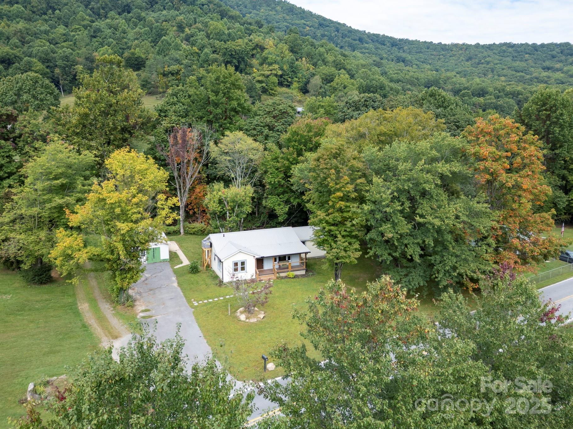 1808 Allens Creek Road Waynesville, NC 28786 - Photo 19 of 45 a view of a house with a yard