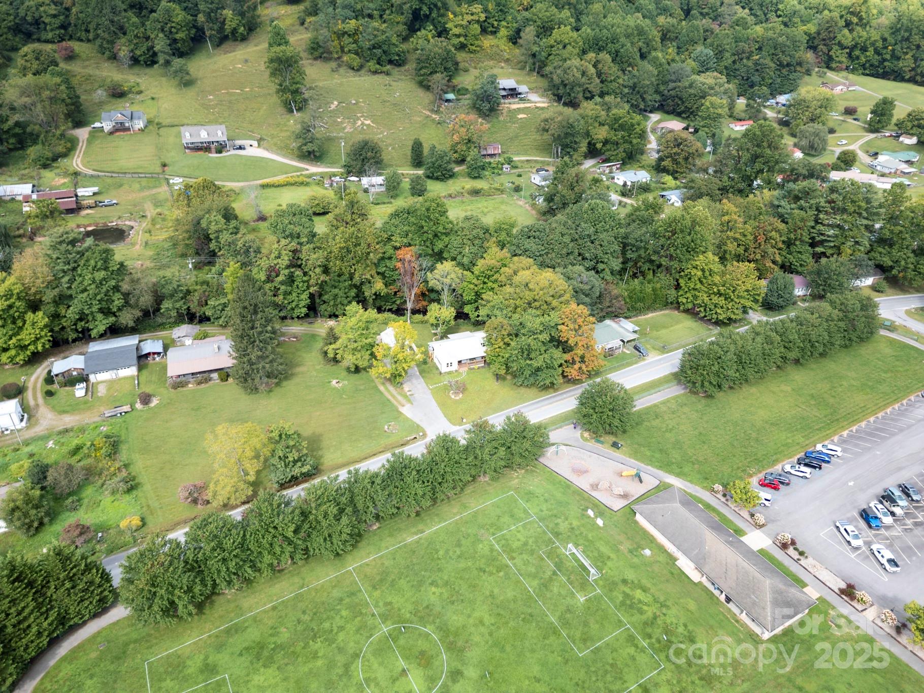 1808 Allens Creek Road Waynesville, NC 28786 - Photo 20 of 45 an aerial view of residential houses with outdoor space and trees