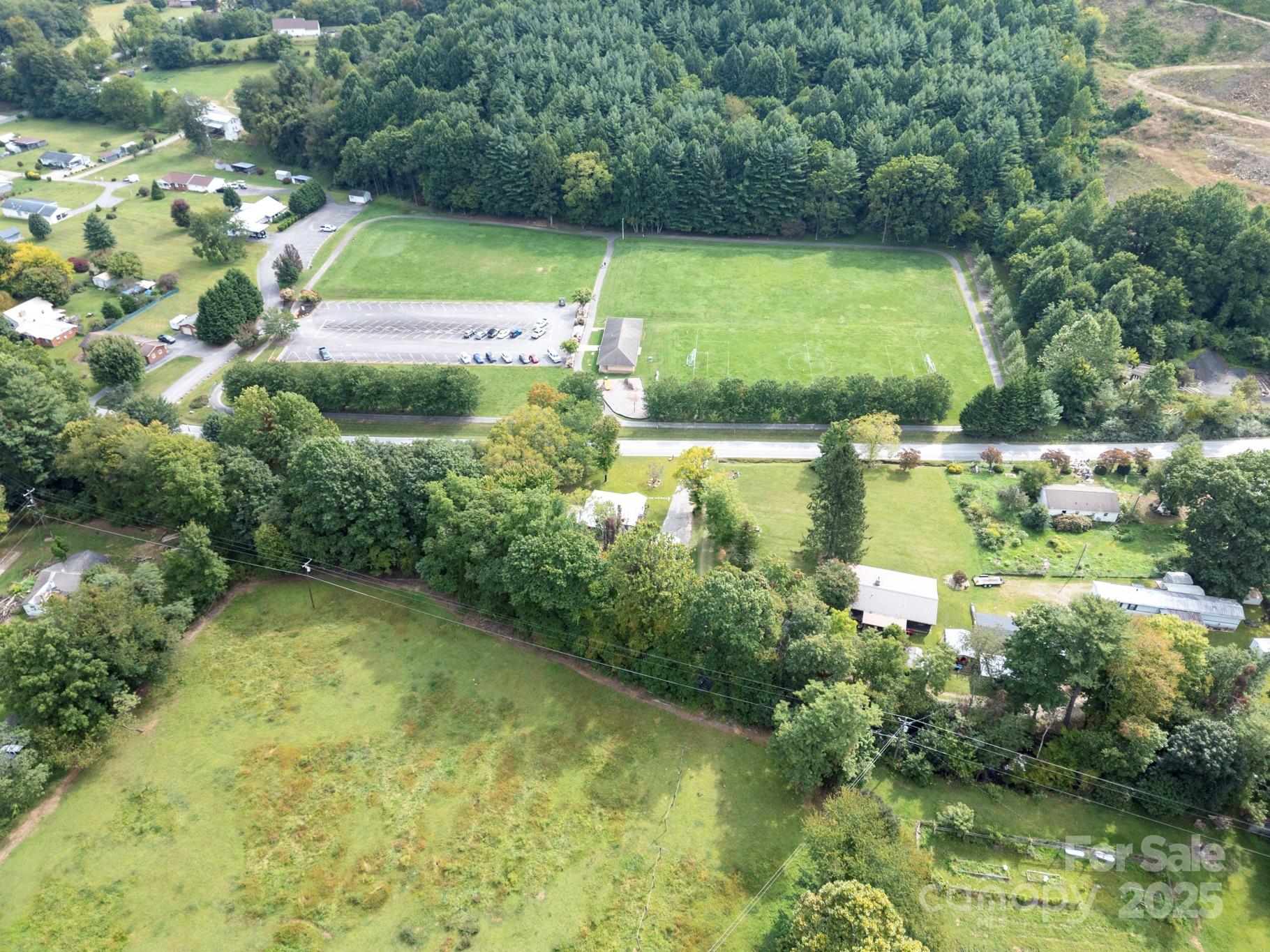 1808 Allens Creek Road Waynesville, NC 28786 - Photo 21 of 45 a view of a lake with a yard