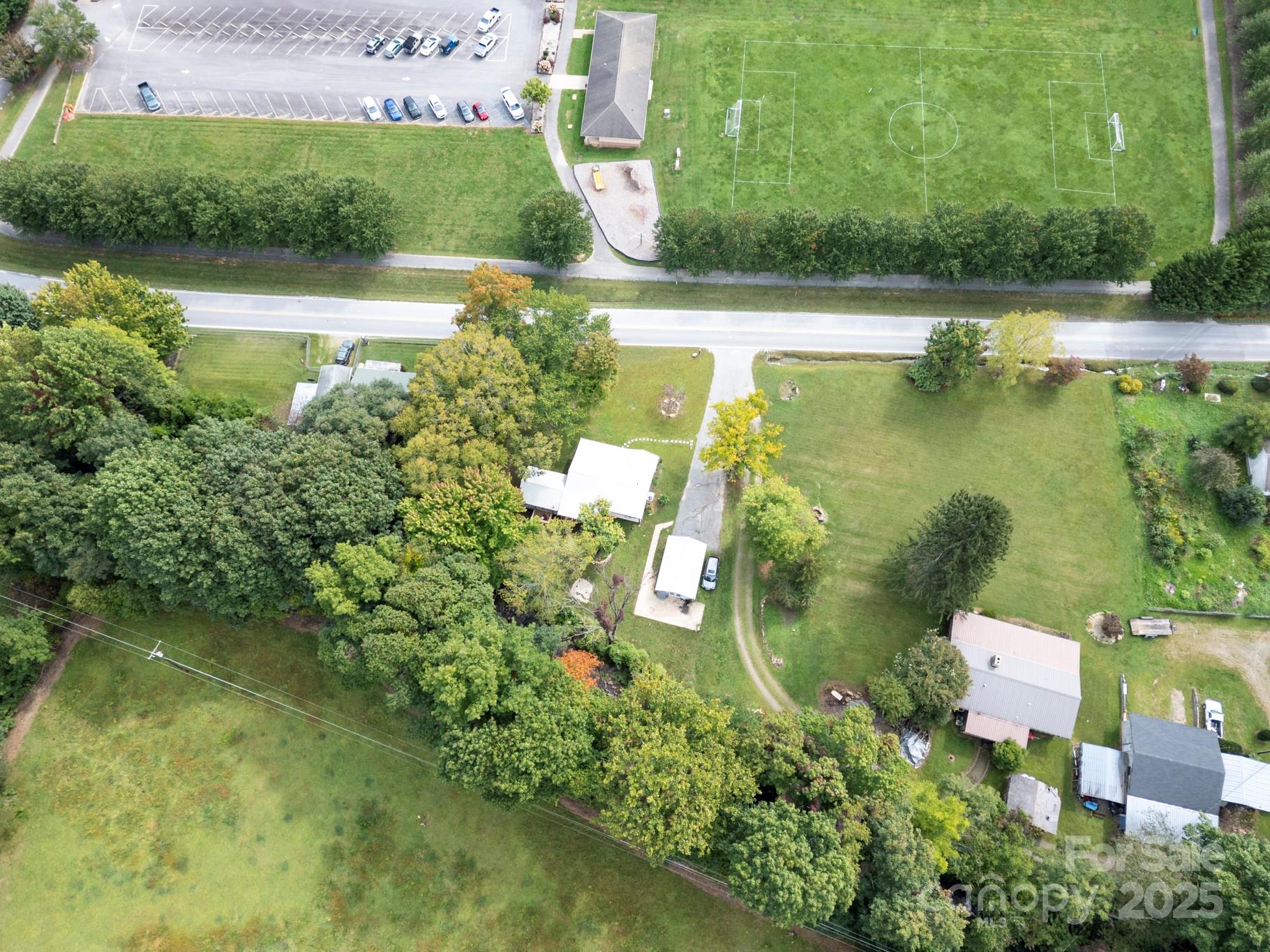 1808 Allens Creek Road Waynesville, NC 28786 - Photo 22 of 45 a view of a lake with a house