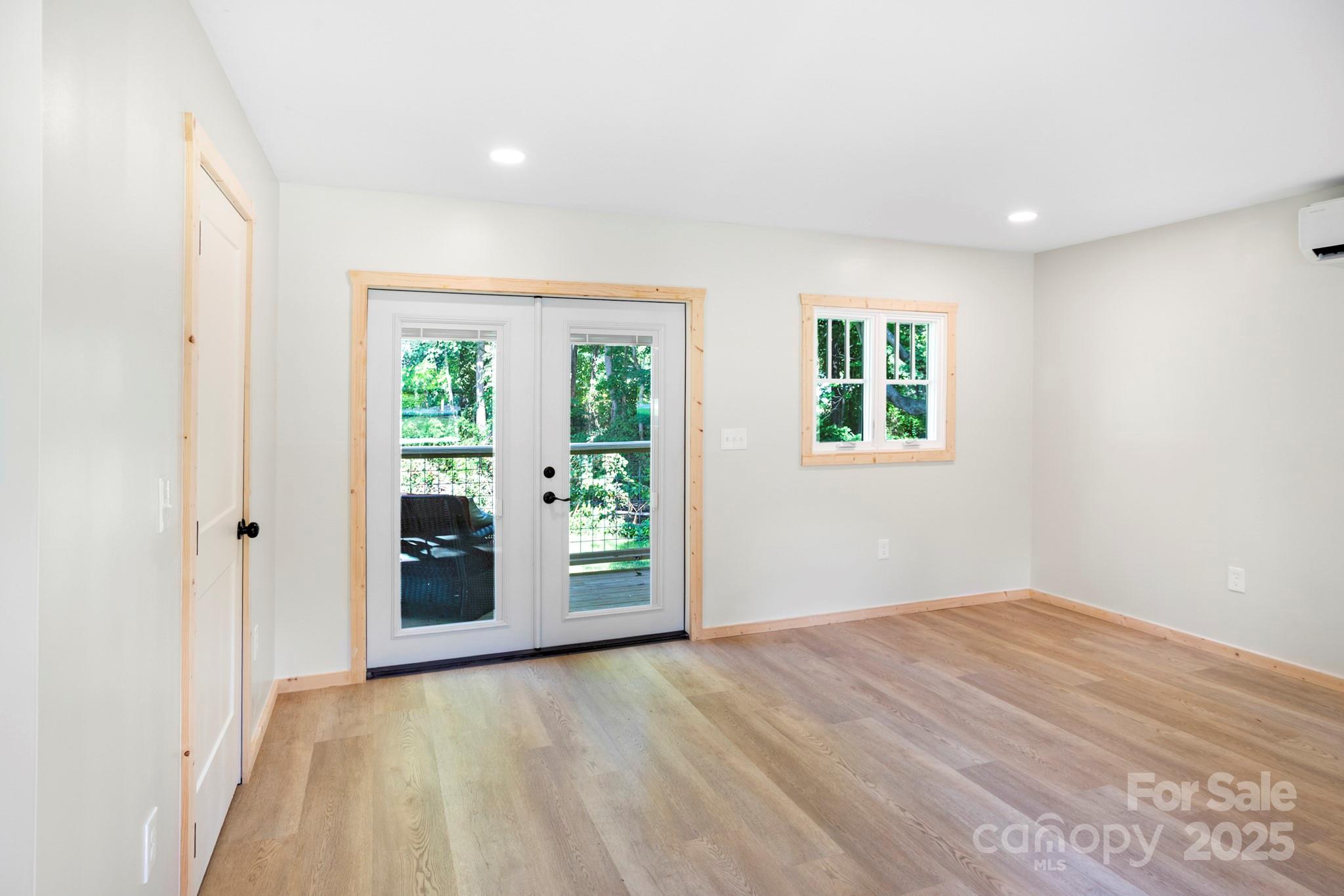 1808 Allens Creek Road Waynesville, NC 28786 - Photo 32 of 45 a view of an empty room with a window
