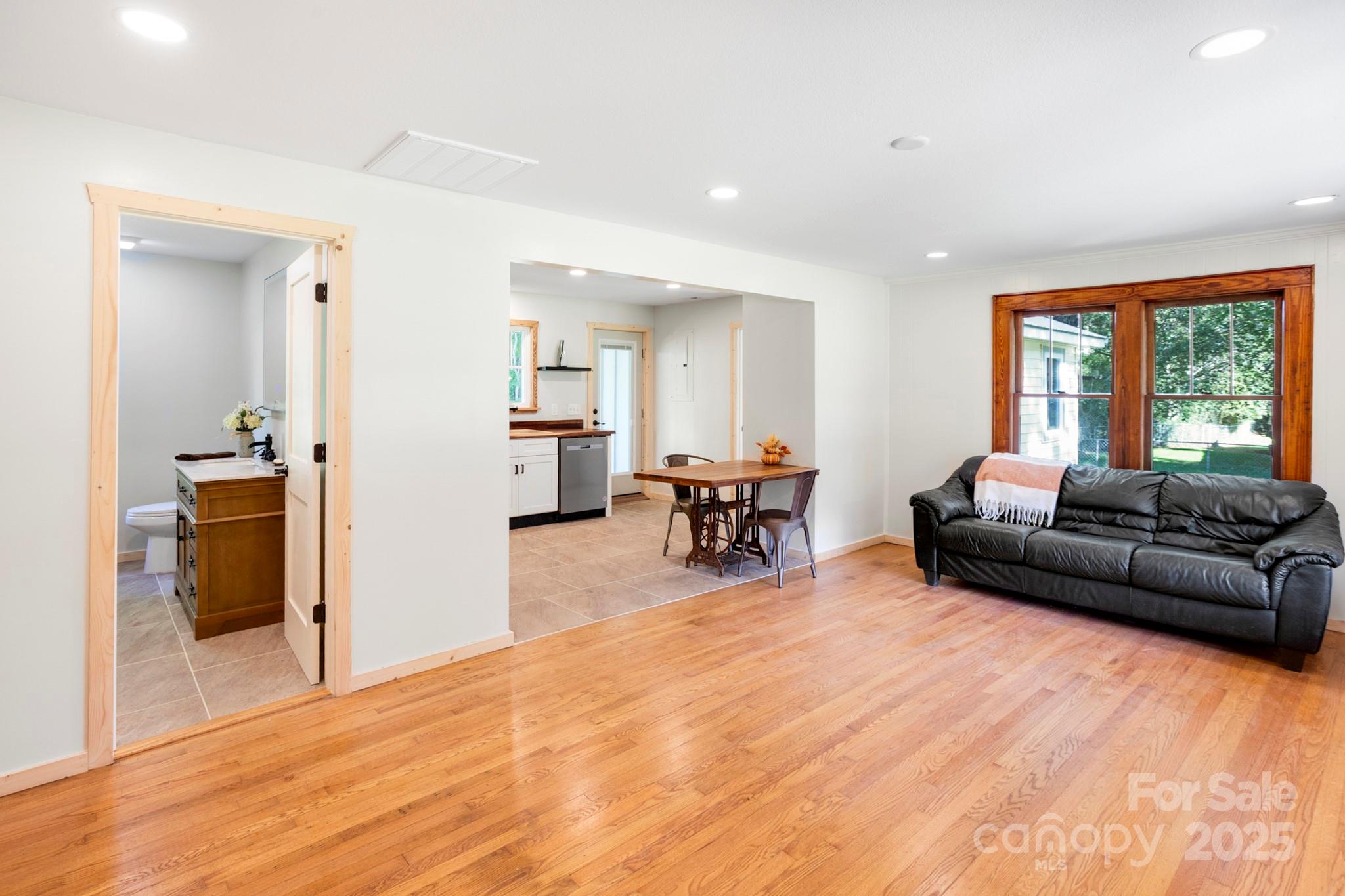 1808 Allens Creek Road Waynesville, NC 28786 - Photo 33 of 45 a living room with furniture and a large window