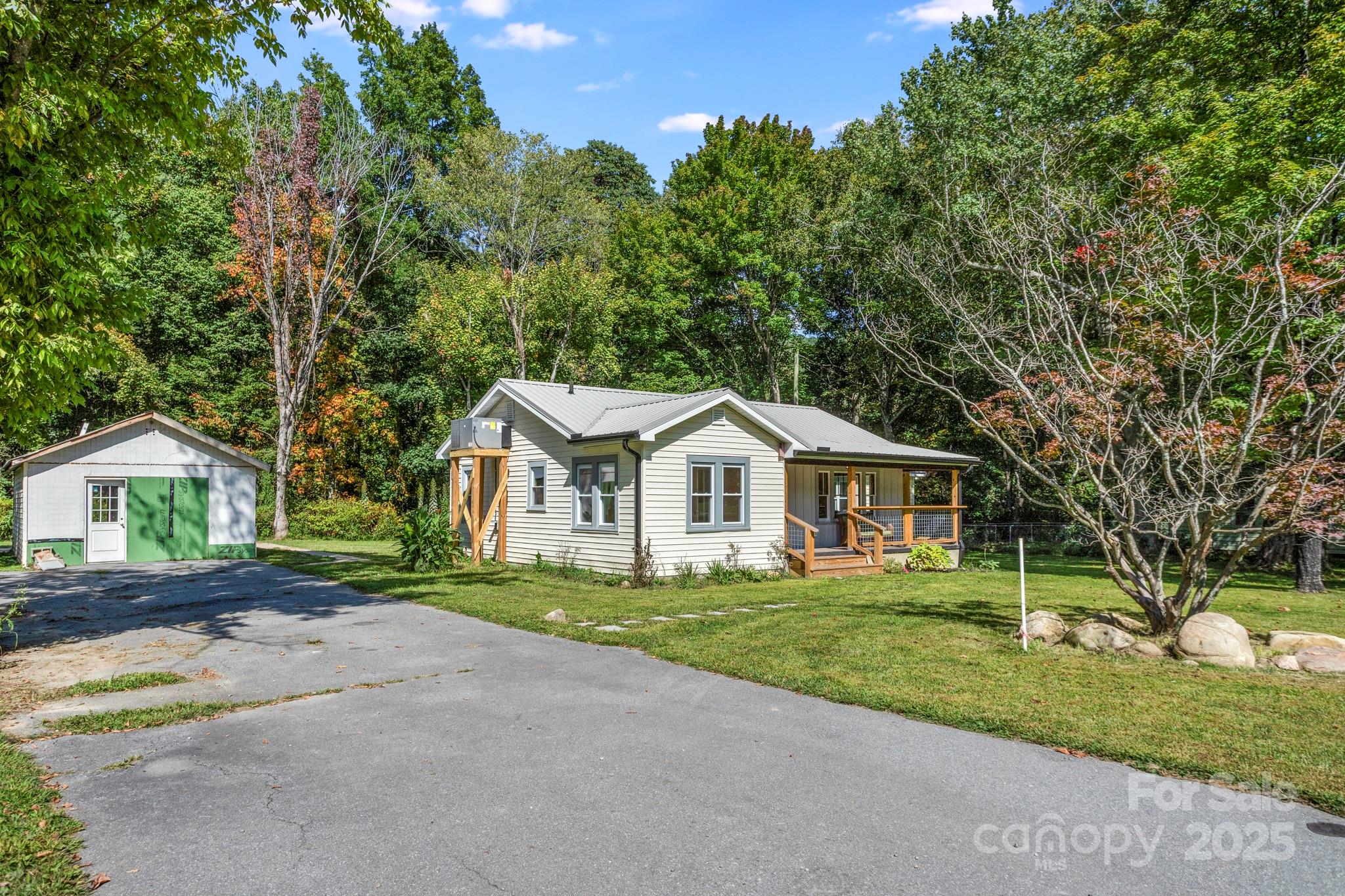 1808 Allens Creek Road Waynesville, NC 28786 - Photo 4 of 45 a front view of a house with a yard