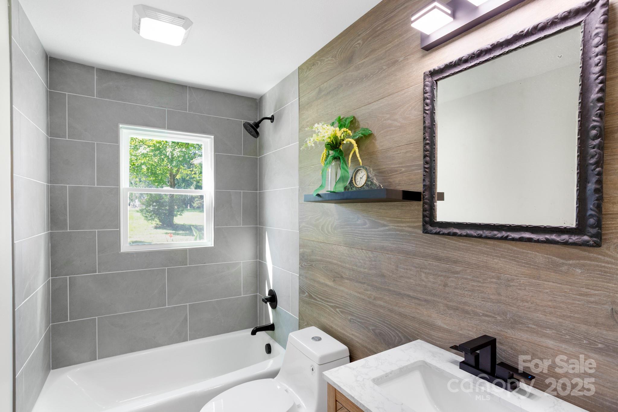 1808 Allens Creek Road Waynesville, NC 28786 - Photo 41 of 45 a bathroom with a sink and a bathtub