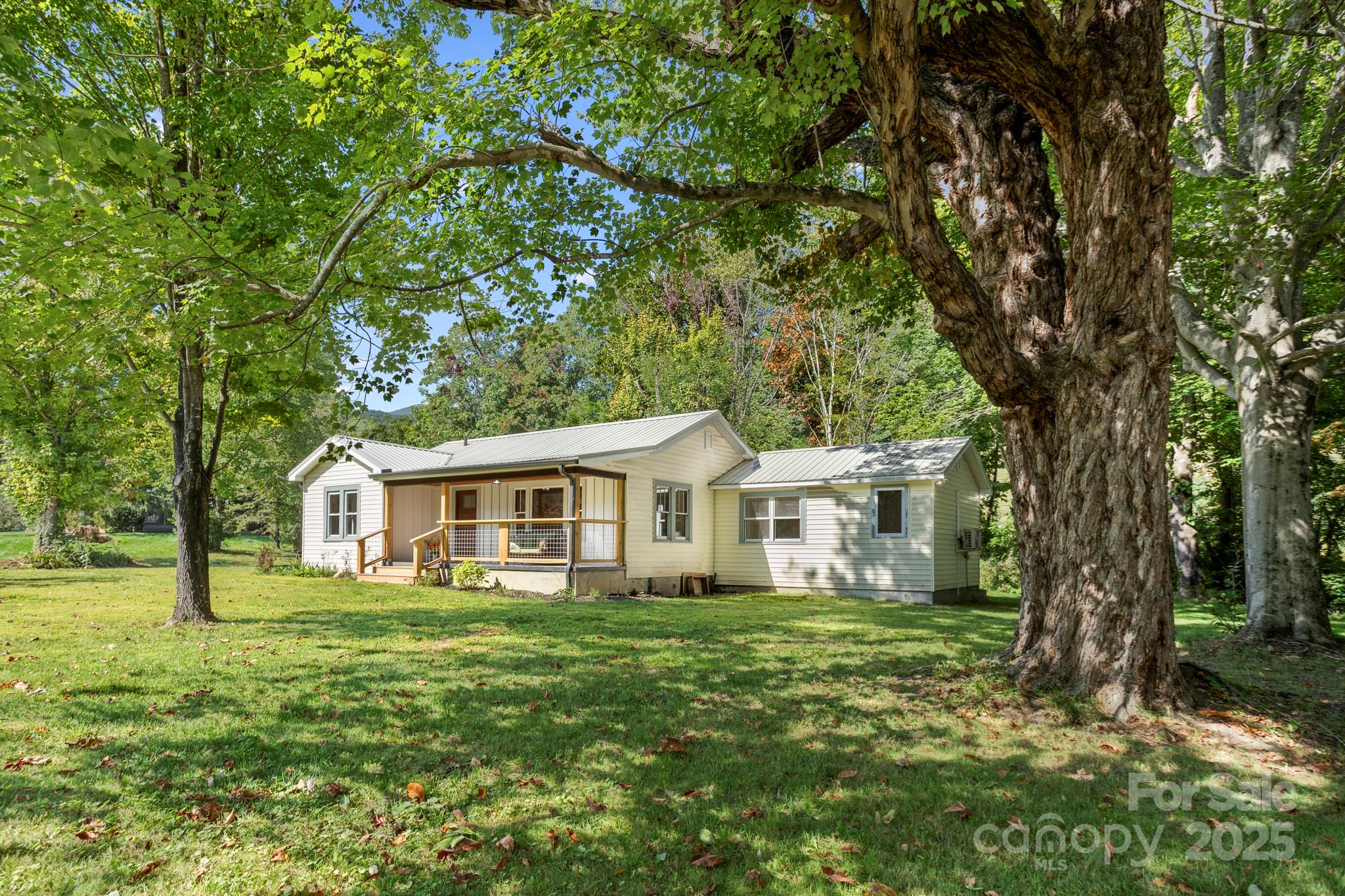 1808 Allens Creek Road Waynesville, NC 28786 - Photo 5 of 45 a front view of a house with garden