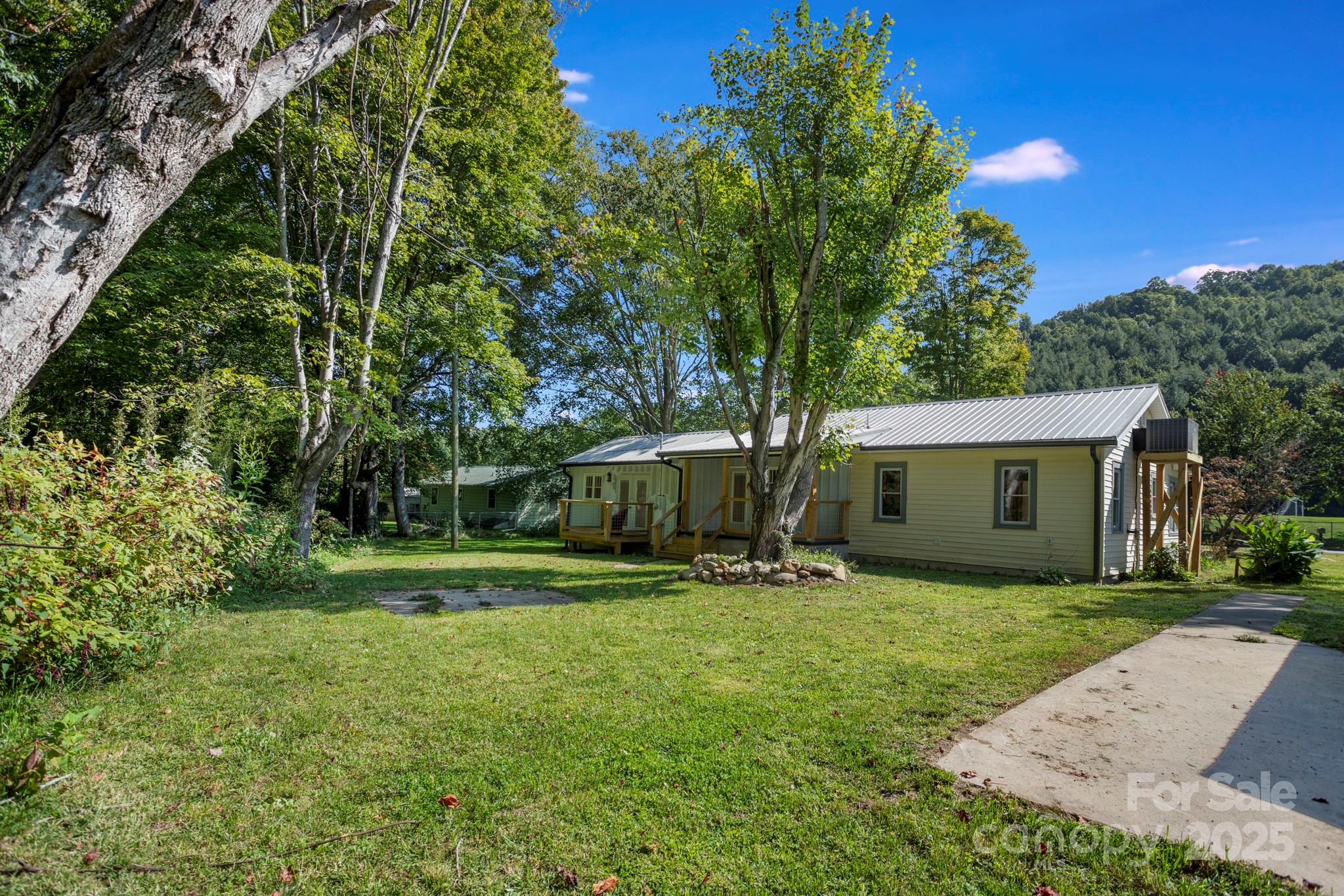1808 Allens Creek Road Waynesville, NC 28786 - Photo 6 of 45 a front view of house with yard and trees