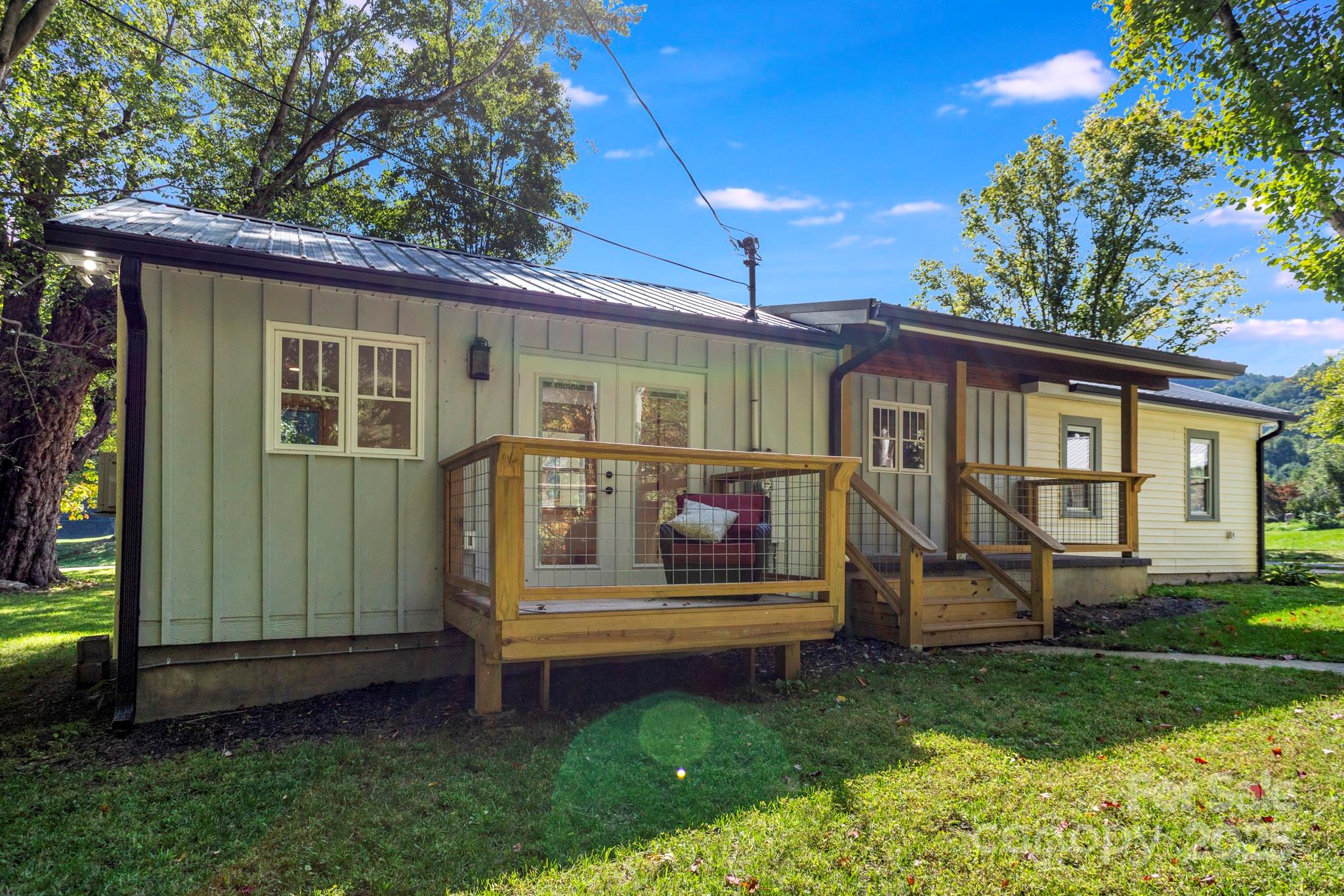 1808 Allens Creek Road Waynesville, NC 28786 - Photo 7 of 45 a front view of a house with a yard