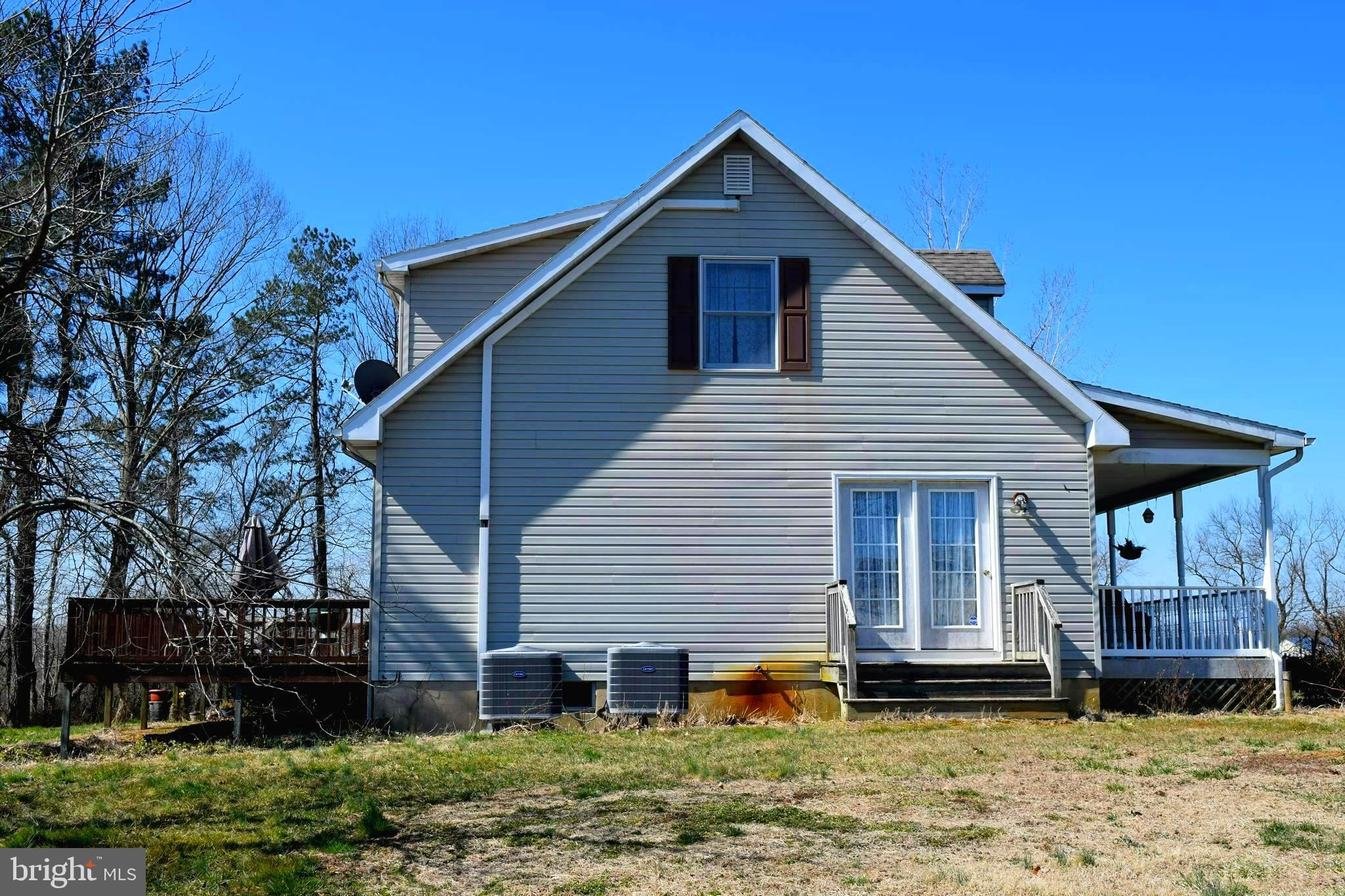 11479 Station Road Worton, MD 21678 - Photo 3 of 65 Side view of home showing doors off primary bdrm.