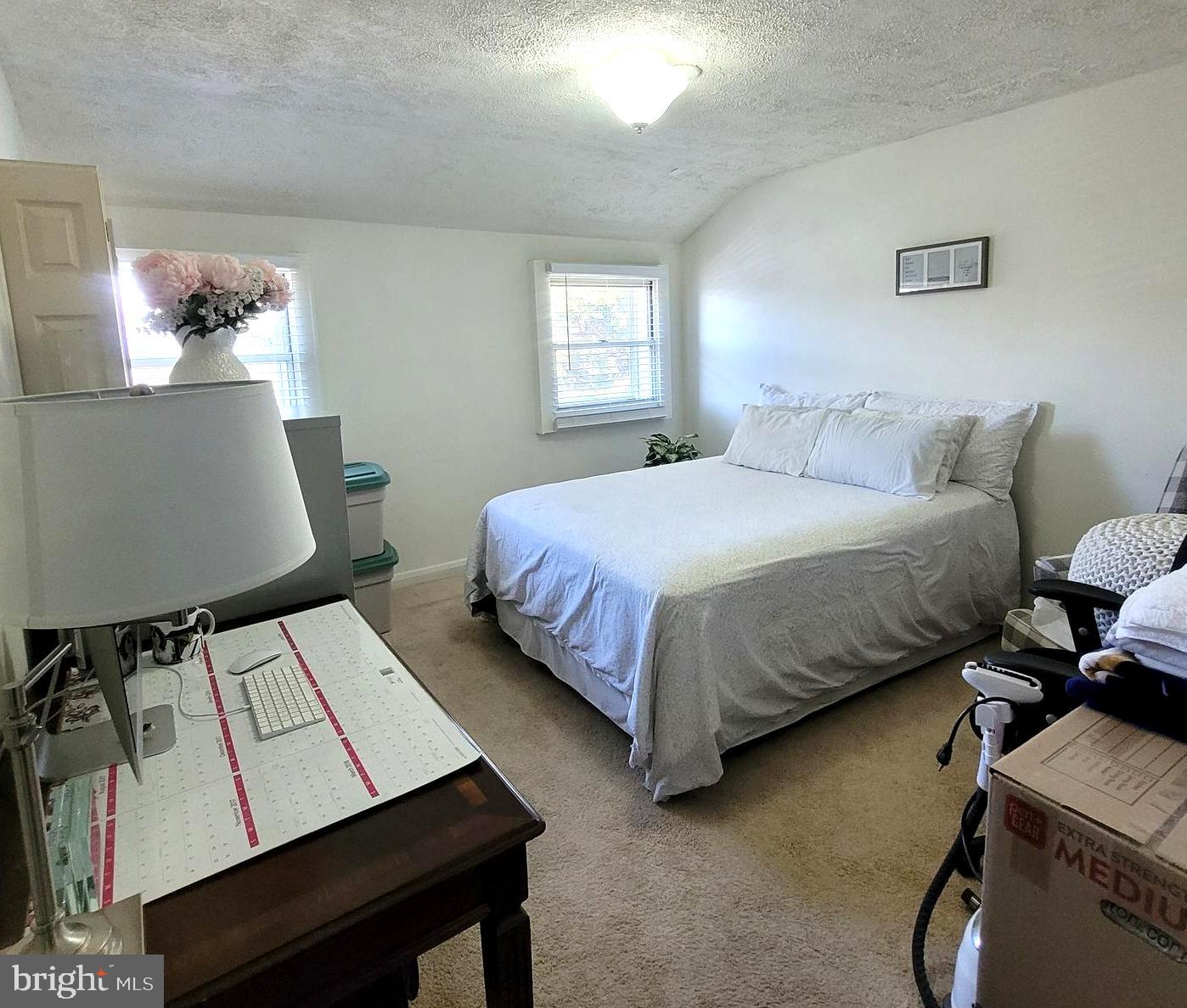 8035 Kimberly Road Dundalk, MD 21222 - Photo 5 of 8 a bedroom with a bed and a window