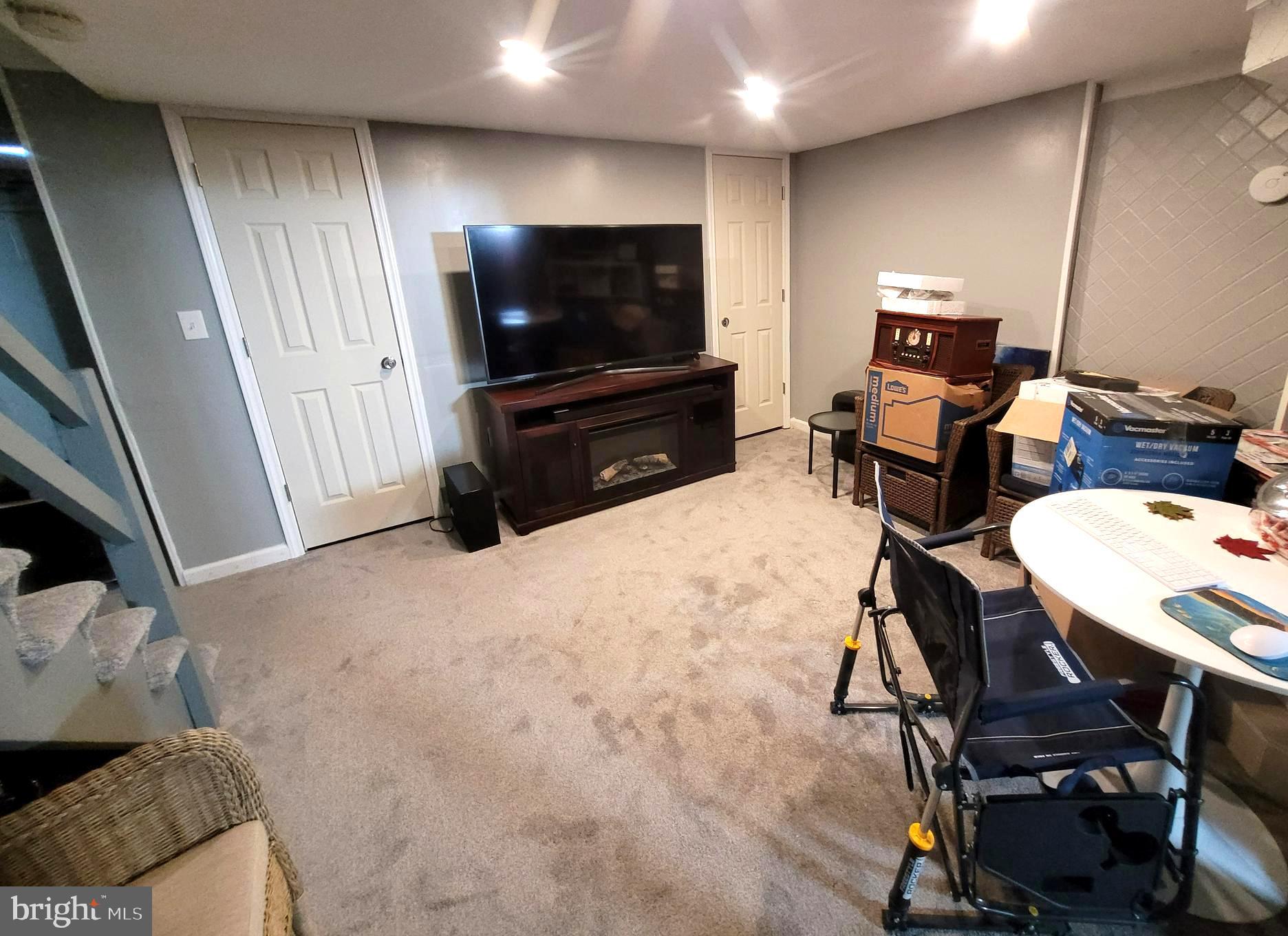 8035 Kimberly Road Dundalk, MD 21222 - Photo 8 of 8 a living room with furniture and a flat screen tv