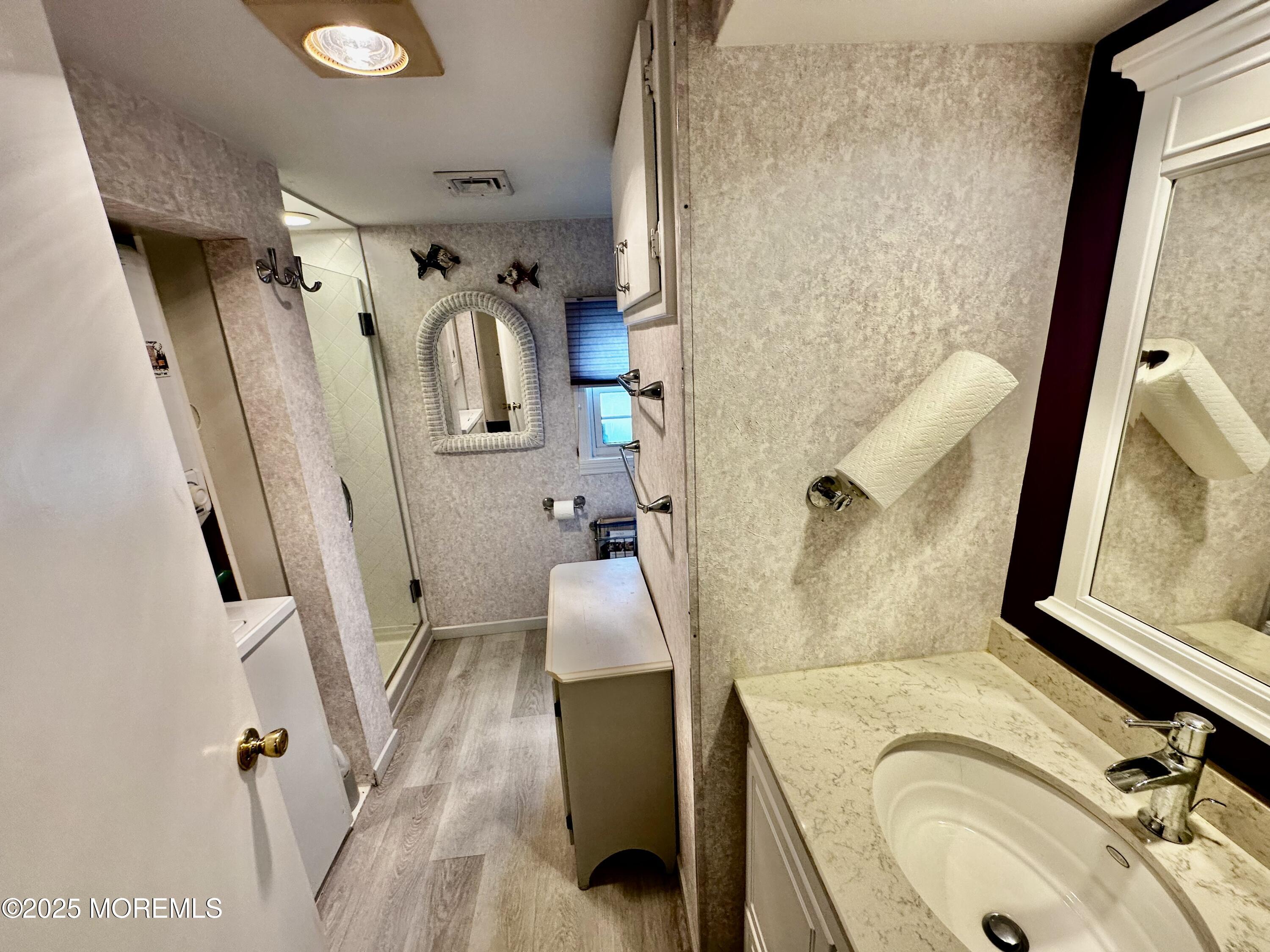 37 East Flamingo Way Lavallette, NJ 08735 - Photo 11 of 17 a bathroom with a sink a toilet and a tub