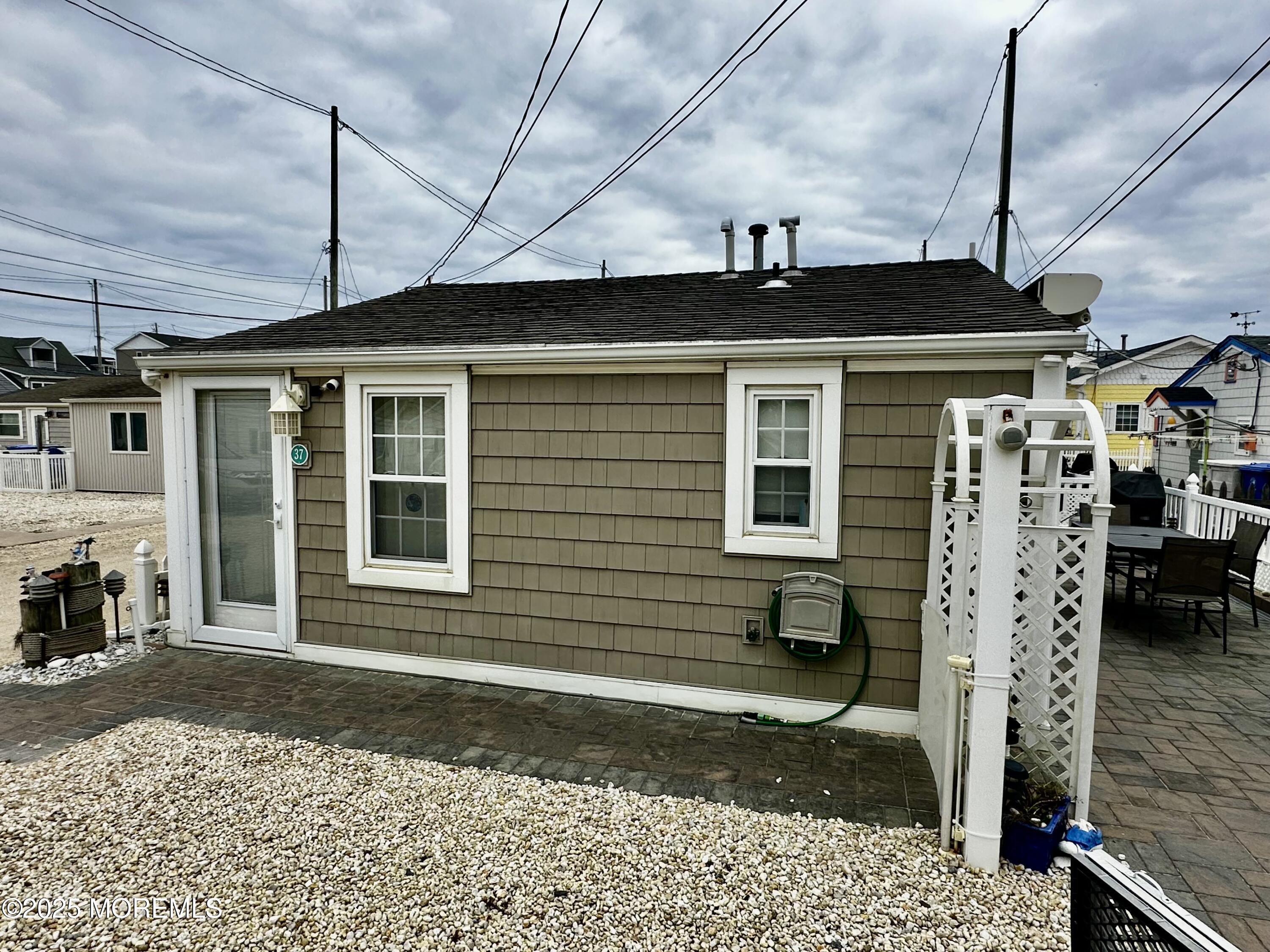 37 East Flamingo Way Lavallette, NJ 08735 - Photo 16 of 17 a front view of a house with a yard