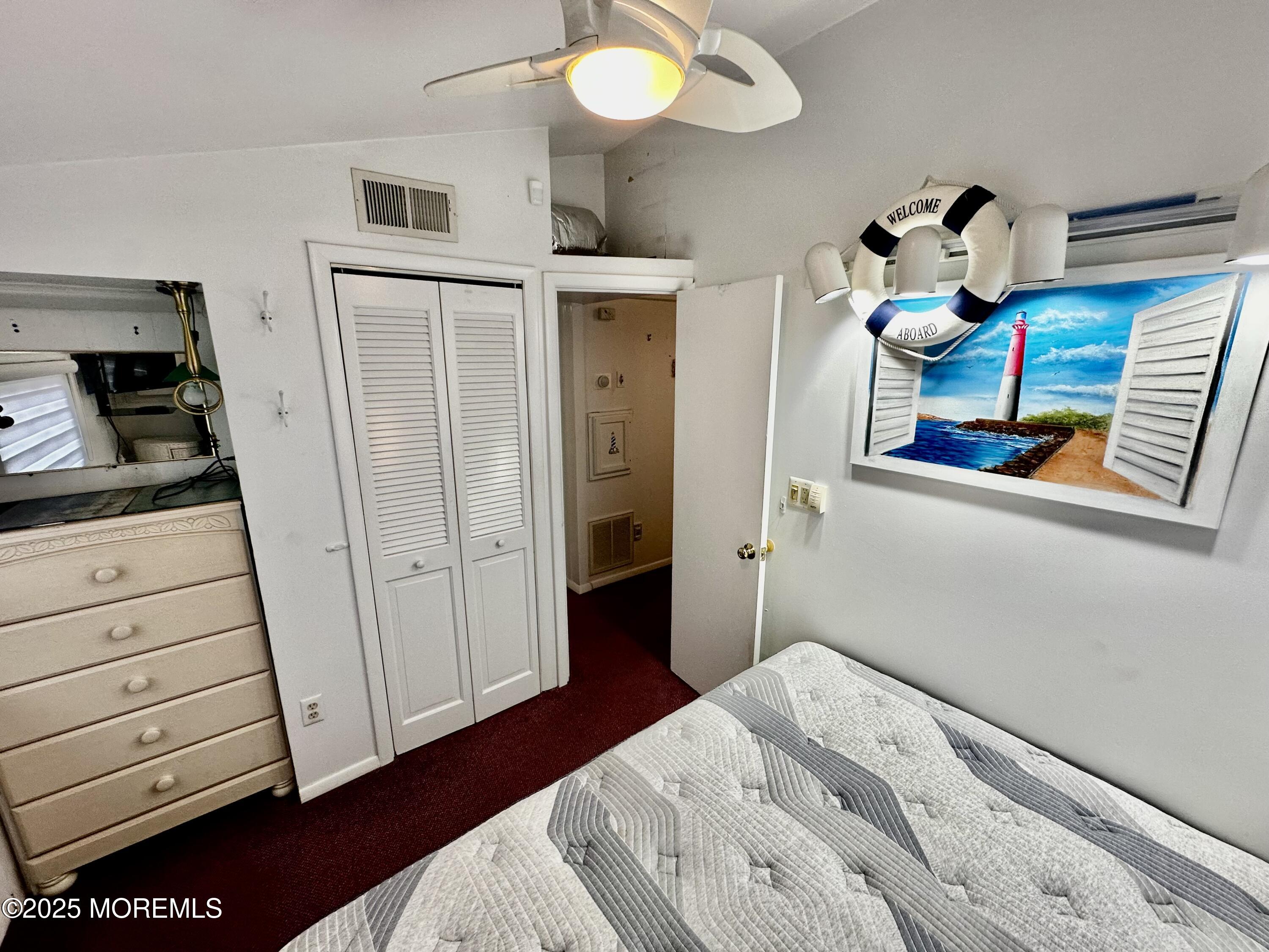 37 East Flamingo Way Lavallette, NJ 08735 - Photo 6 of 17 a bedroom with a bed and wooden floor