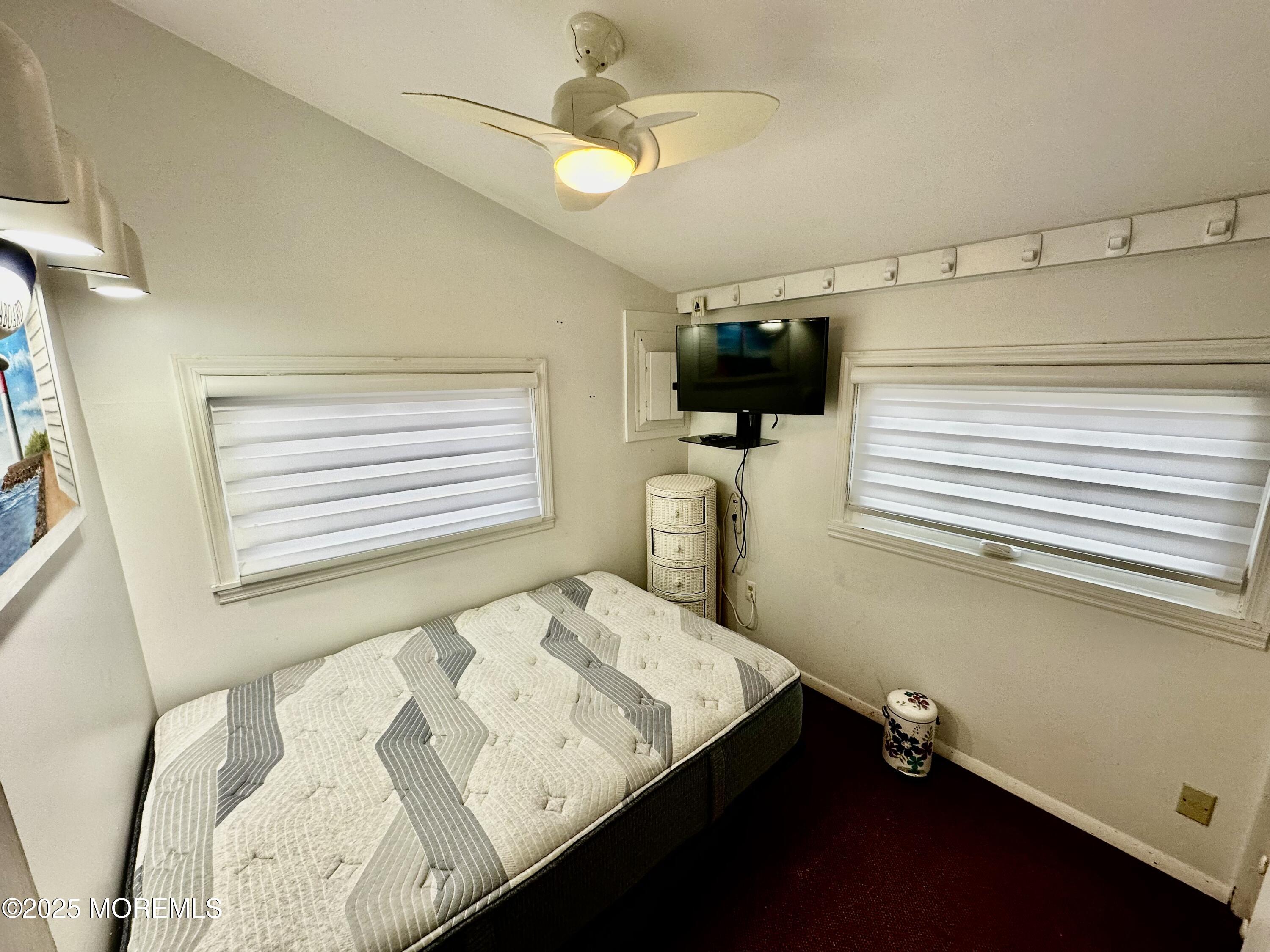 37 East Flamingo Way Lavallette, NJ 08735 - Photo 7 of 17 a bedroom with a bed and a flat screen tv