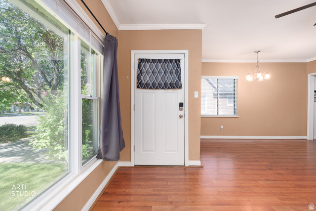 146 West 200 N Street Springville, UT 84663 - Photo 4 of 29 Entryway featuring a white door with an upper decorative insert, wood-finish flooring, and crown molding