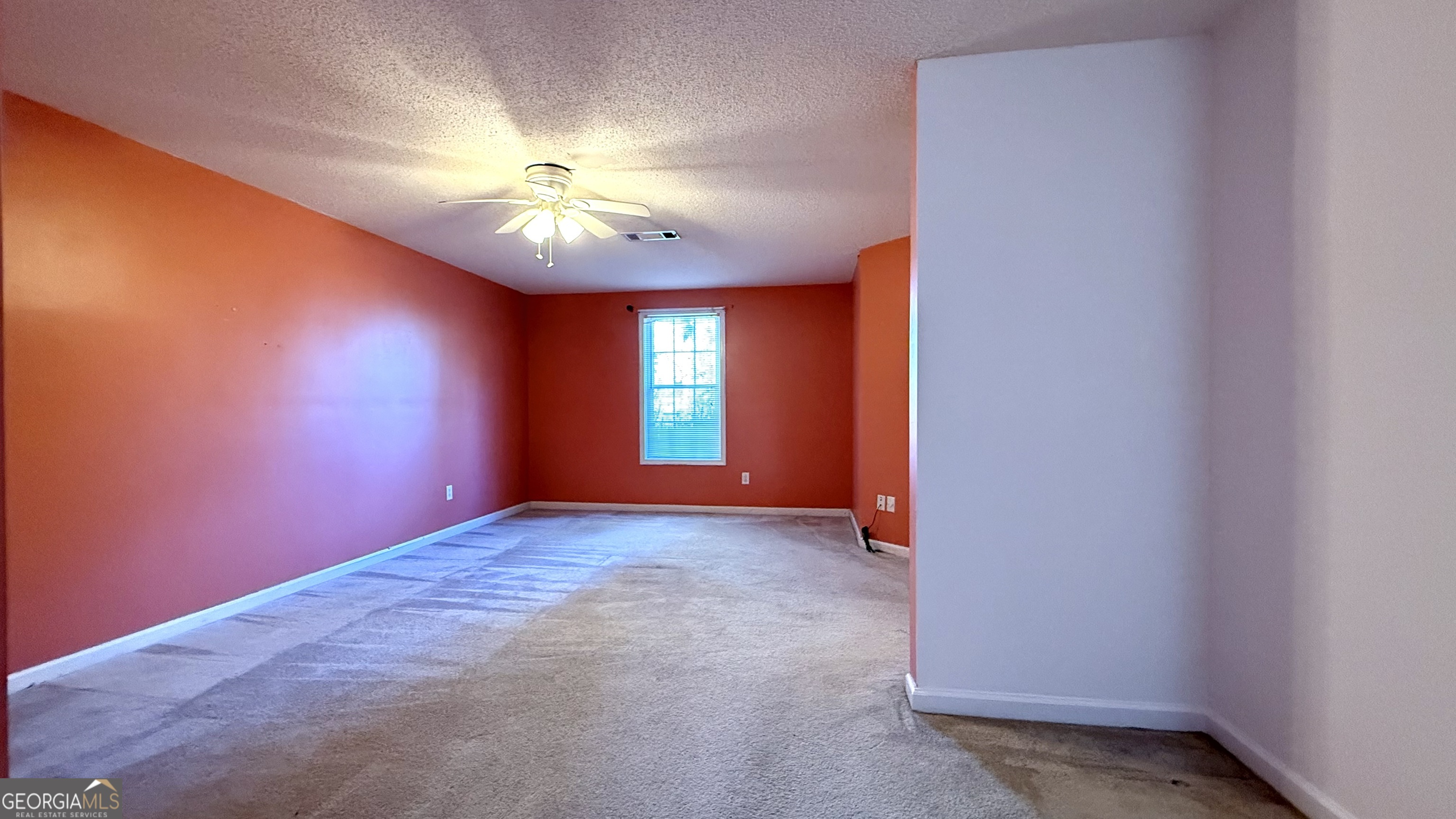 230 Mels Way Stockbridge, GA 30281 - Photo 26 of 40 a view of an empty room and chandelier fan