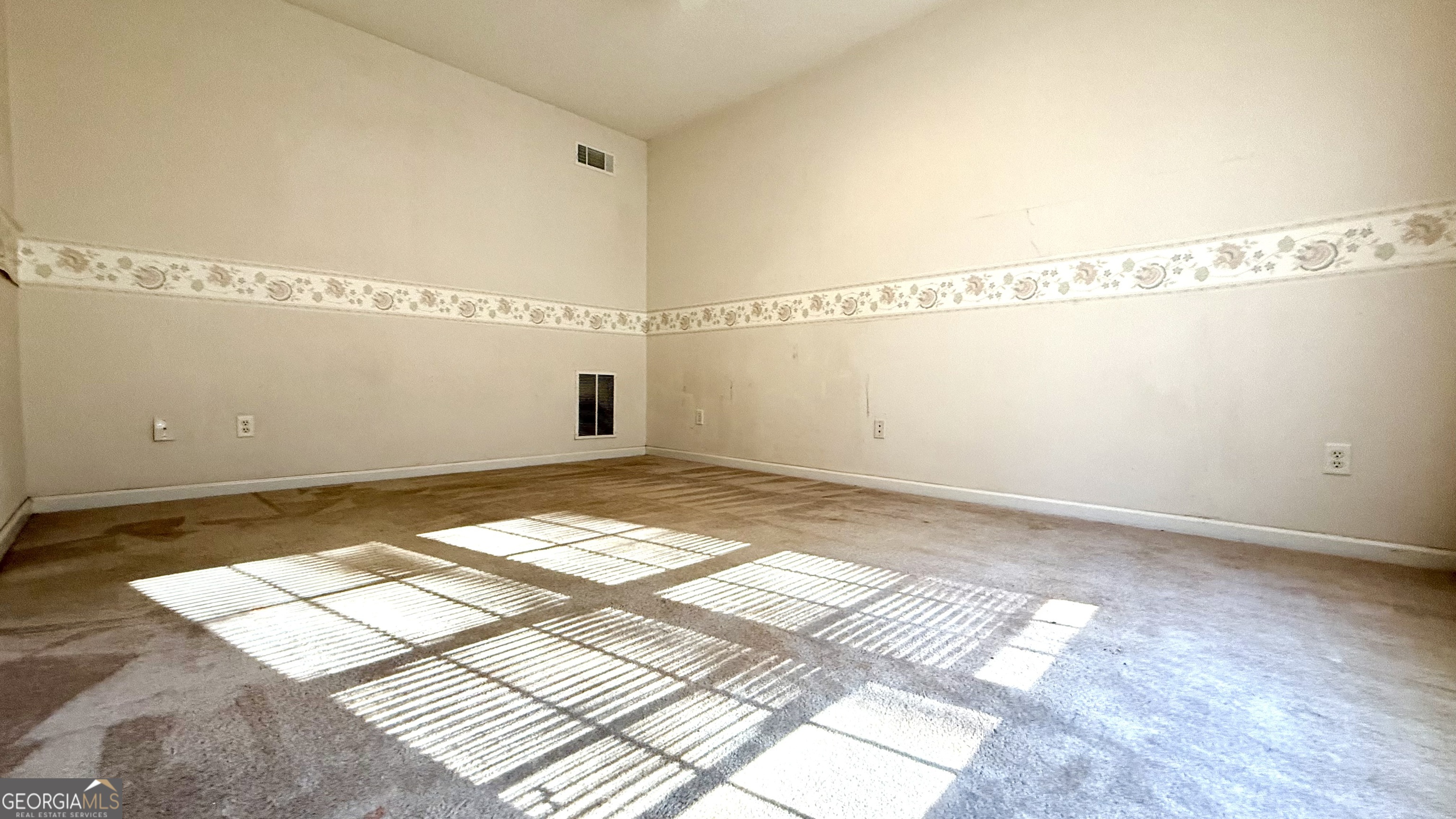230 Mels Way Stockbridge, GA 30281 - Photo 29 of 40 a view of a room with wooden floor and white walls