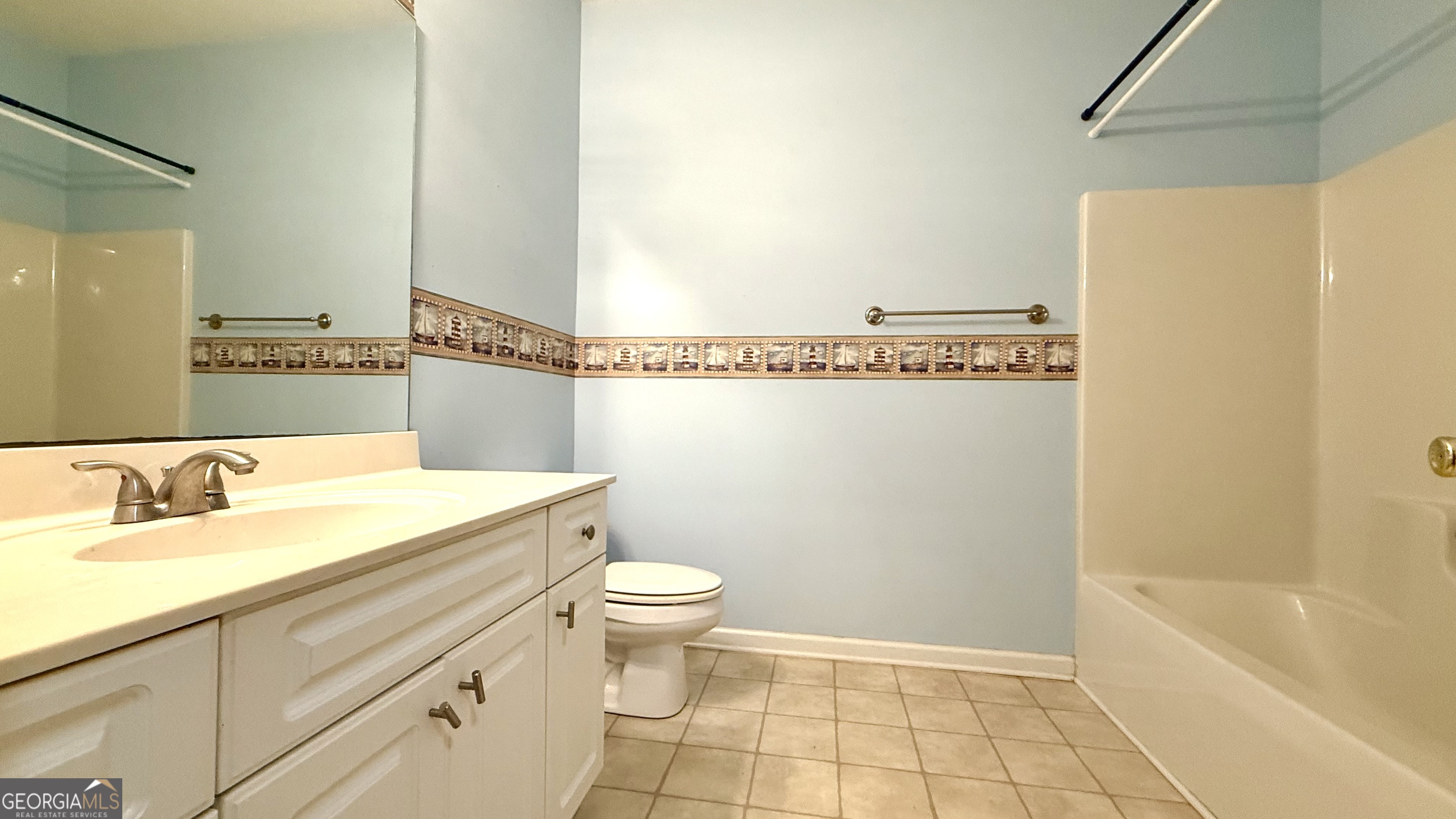 230 Mels Way Stockbridge, GA 30281 - Photo 31 of 40 a bathroom with a sink a toilet and bathtub