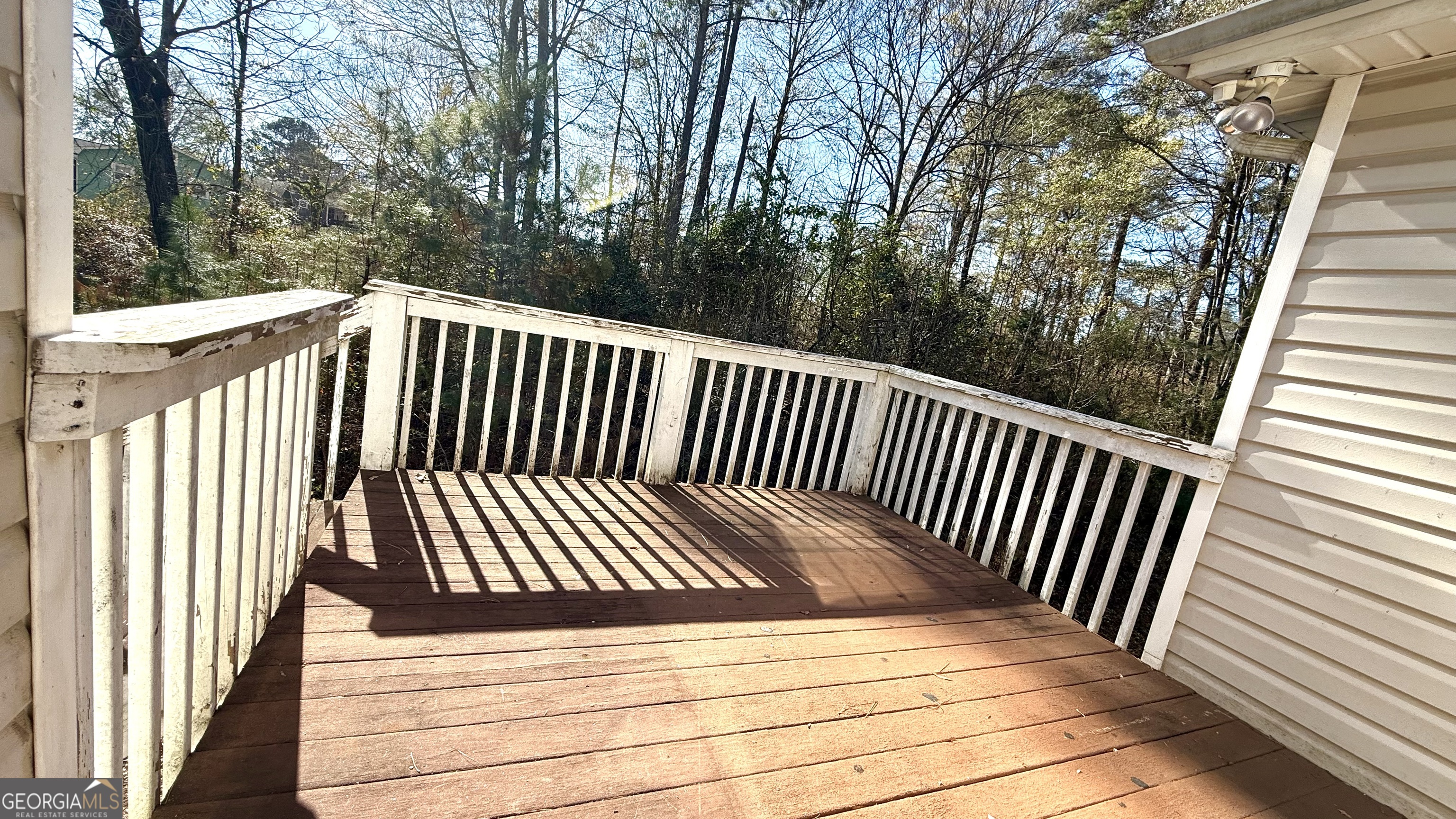 230 Mels Way Stockbridge, GA 30281 - Photo 33 of 40 a view of balcony with wooden floor and fence