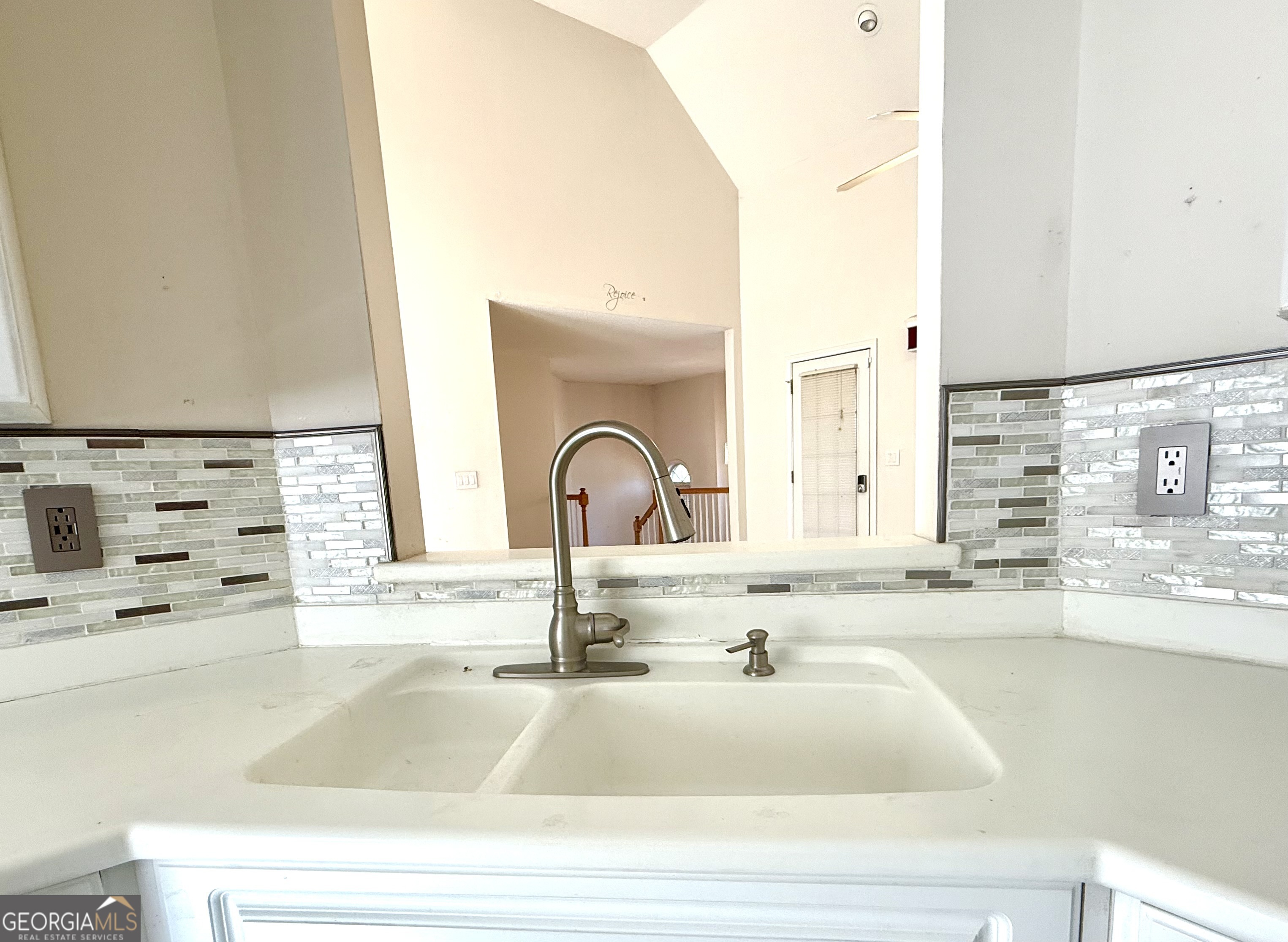 230 Mels Way Stockbridge, GA 30281 - Photo 5 of 40 a kitchen with granite countertop a sink and a stove top oven