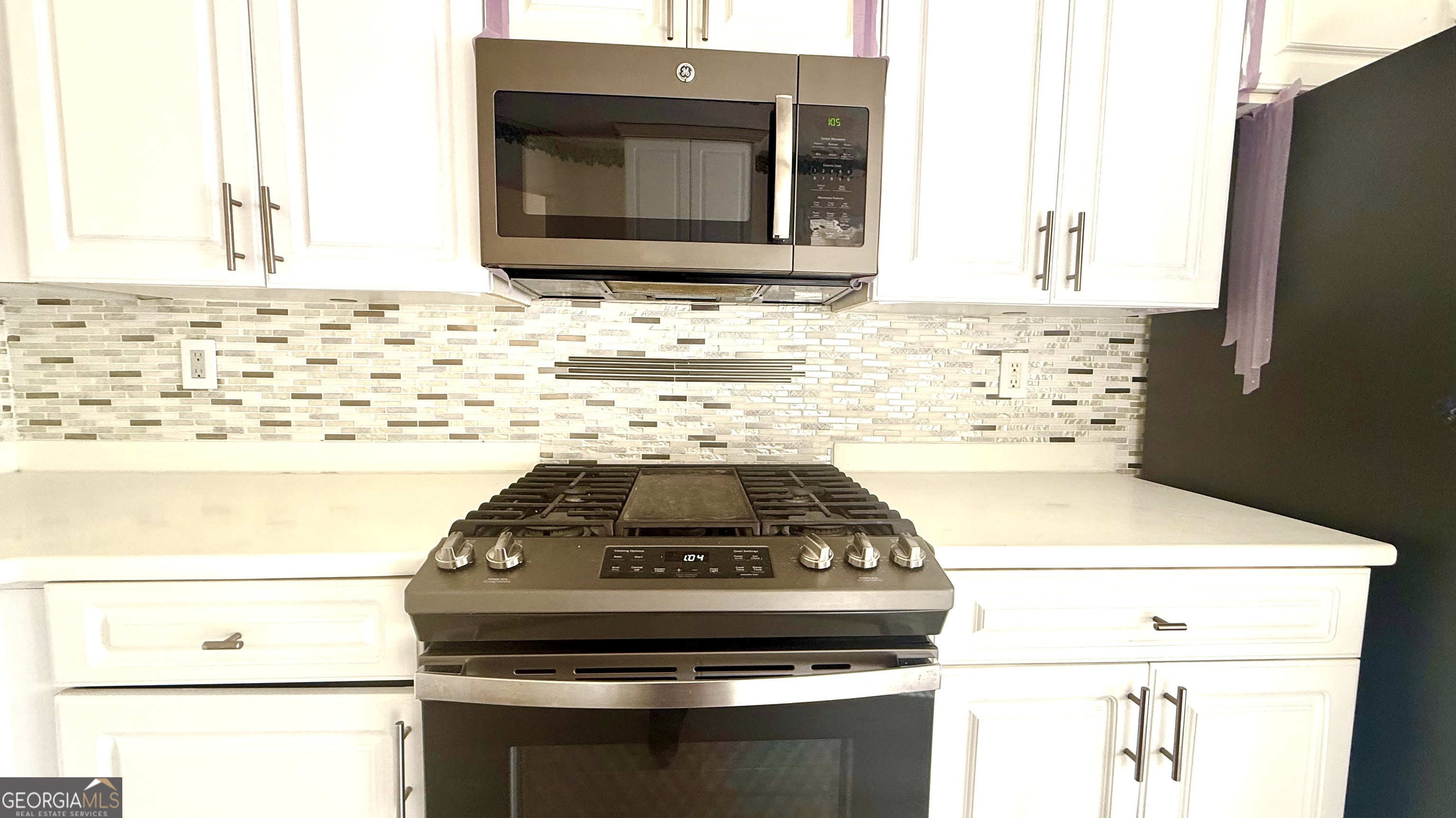 230 Mels Way Stockbridge, GA 30281 - Photo 6 of 40 a stove top oven sitting inside of a kitchen
