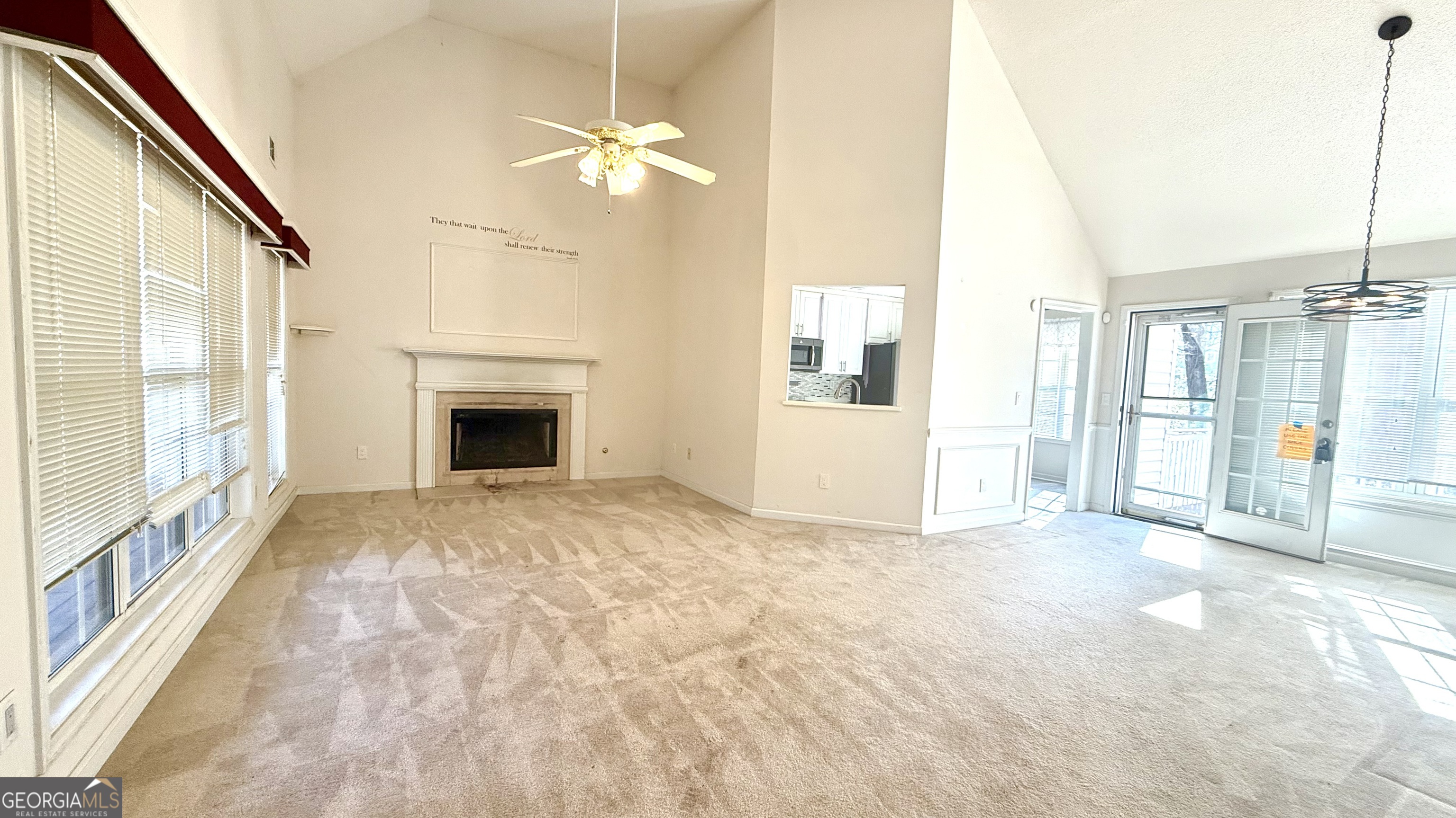 230 Mels Way Stockbridge, GA 30281 - Photo 8 of 40 a view of empty room with floor to ceiling windows