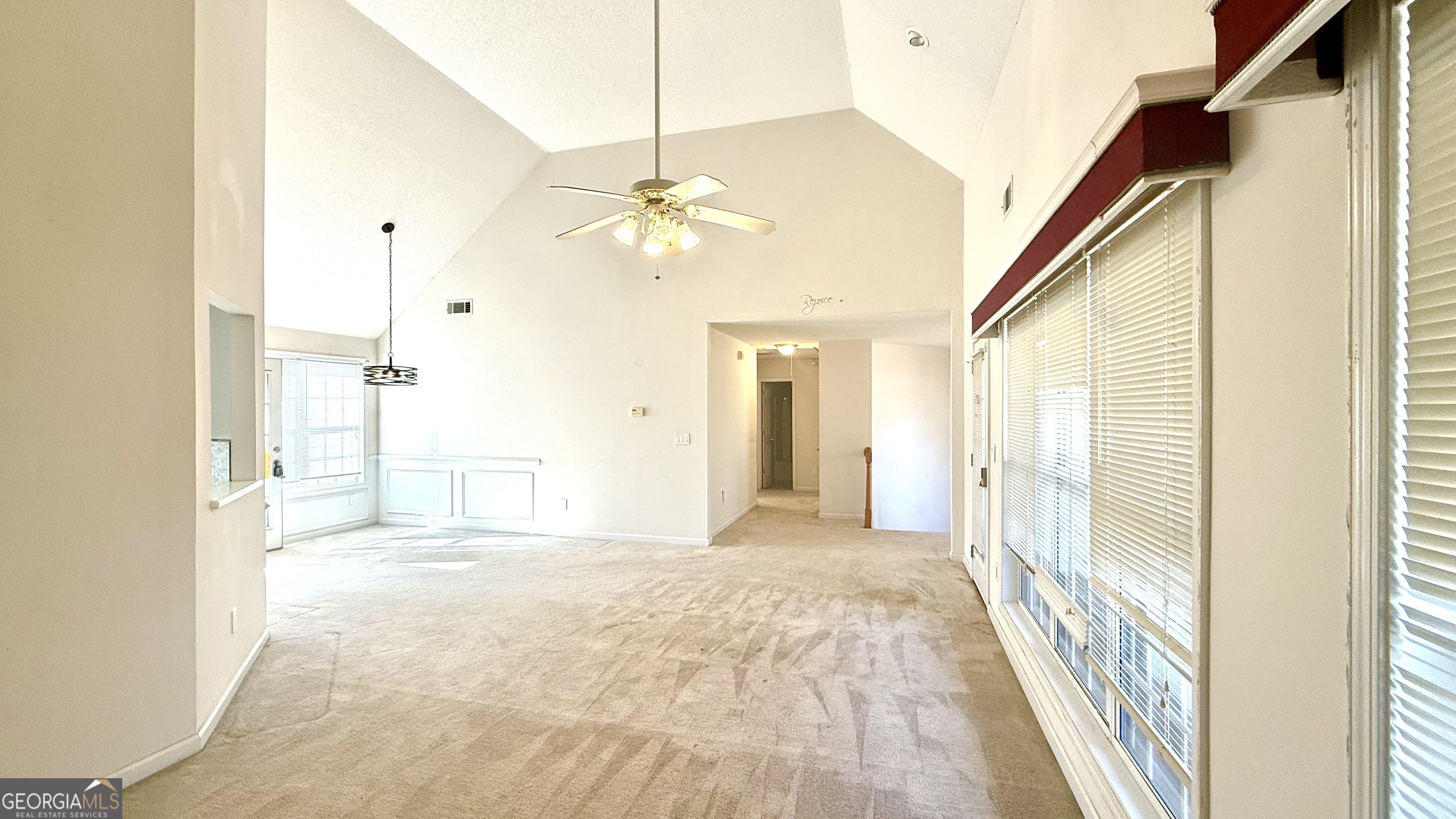 230 Mels Way Stockbridge, GA 30281 - Photo 10 of 40 a view of a big room with wooden floor fan and windows