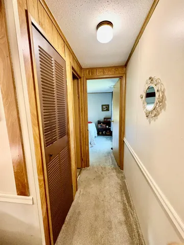 a living room with furniture gym equipment and a large window