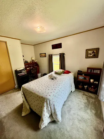 a view of a hallway view with wooden floor and furniture