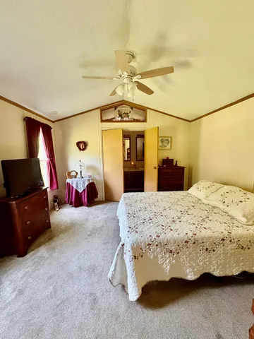a view of living room kitchen with stainless steel appliances cabinets