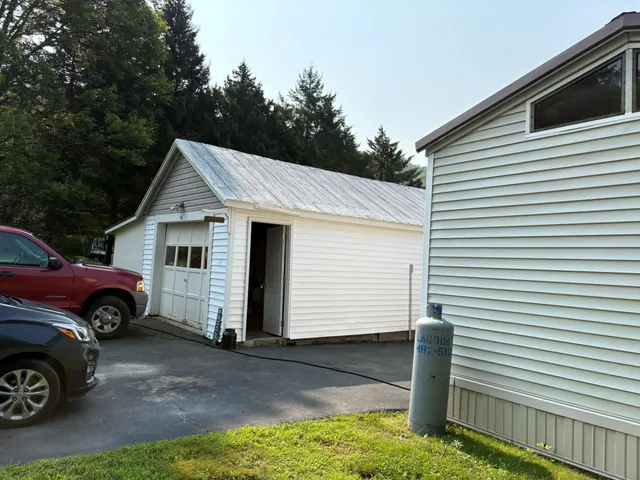 a house view with a sitting space and garden