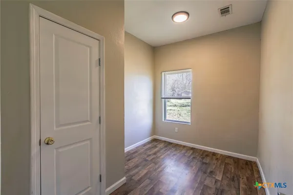 a view of an empty room and window