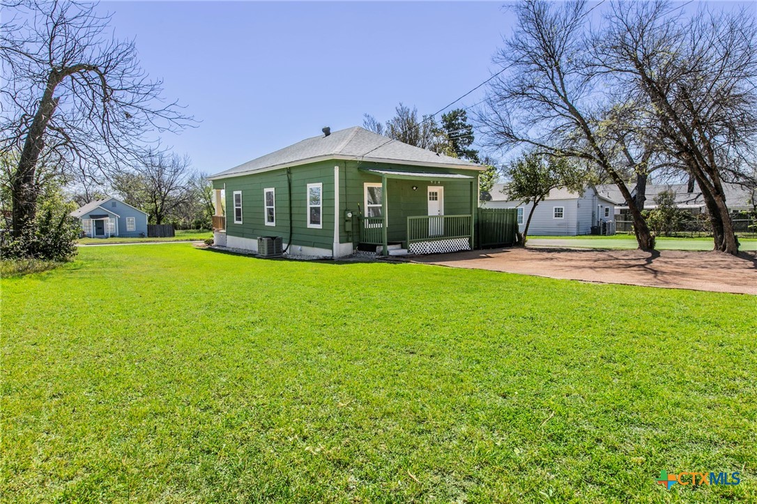 914 South 2nd Street Temple, TX 76504 - Photo 20 of 25 a view of a big yard with a house and large trees