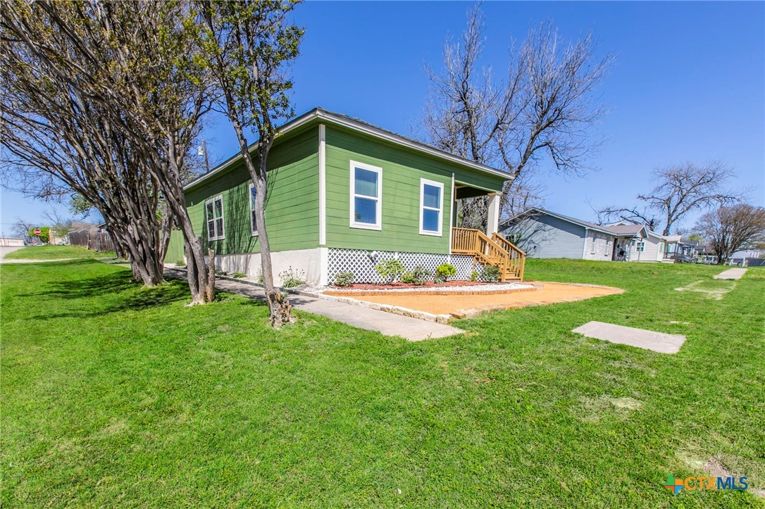 914 South 2nd Street Temple, TX 76504 - Photo 23 of 25 a view of a house with a yard patio and tree