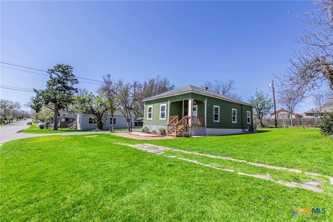 914 South 2nd Street Temple, TX 76504 - Photo 25 of 25 a front view of a house with a garden and porch