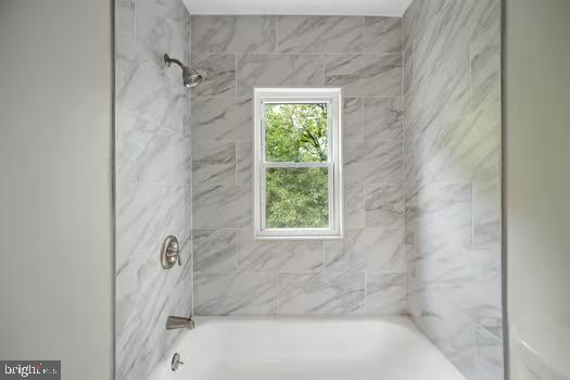 4204 Seidel Avenue Baltimore, MD 21206 - Photo 20 of 23 a bath tub sitting next to a window