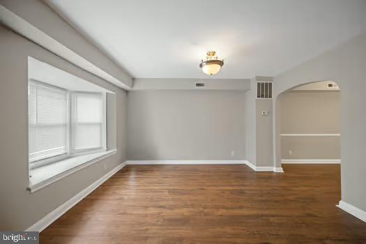 4204 Seidel Avenue Baltimore, MD 21206 - Photo 2 of 23 wooden floor in an empty room with a window