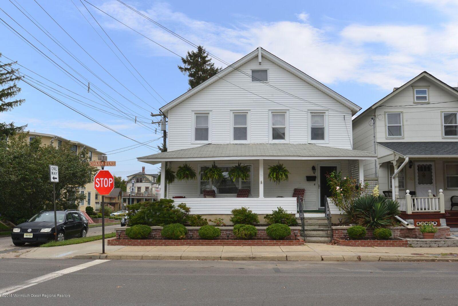 77 Cookman Avenue Ocean Grove, NJ 07756 - Photo 1 of 23 a view of a white house with a large windows and a road